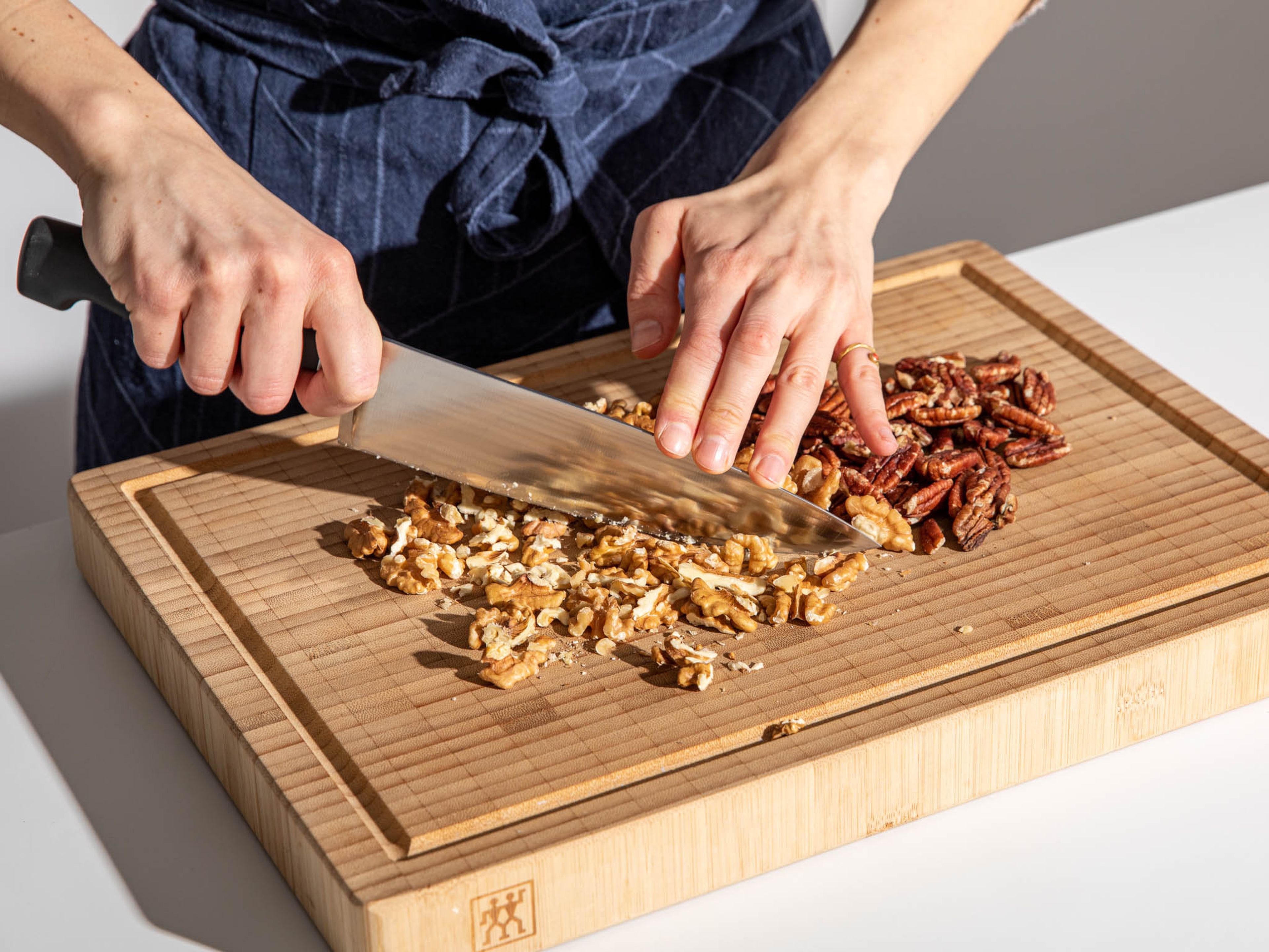 Preheat the oven to 180°C/350°F. Line a baking tray with baking paper and set aside. Roughly chop pecans and walnuts. In a large bowl, add and mix oats, chopped nuts, sesame seeds, ground cinnamon, and salt.