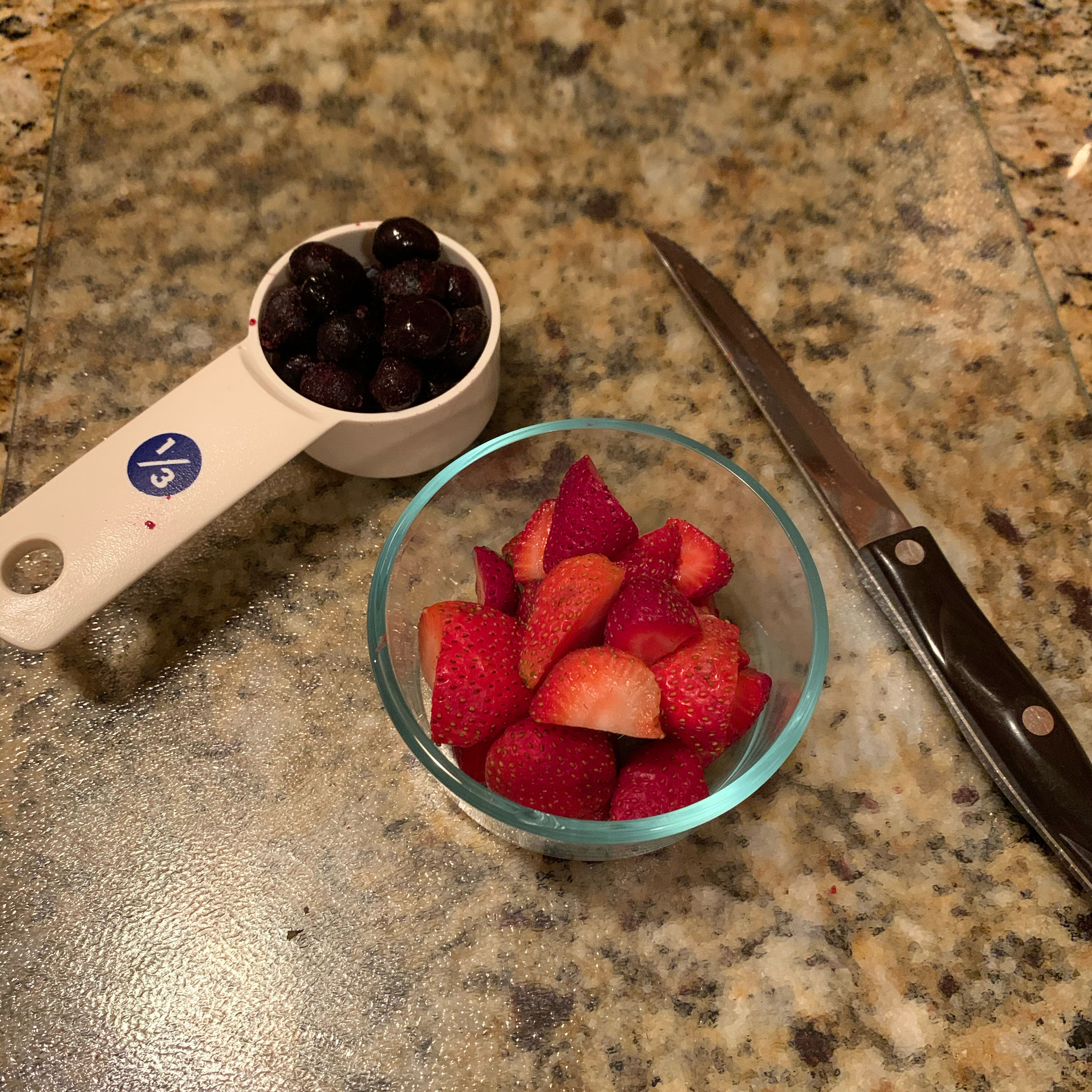 Wash strawberries and cut into halves. Combine with blueberries into a bowl.