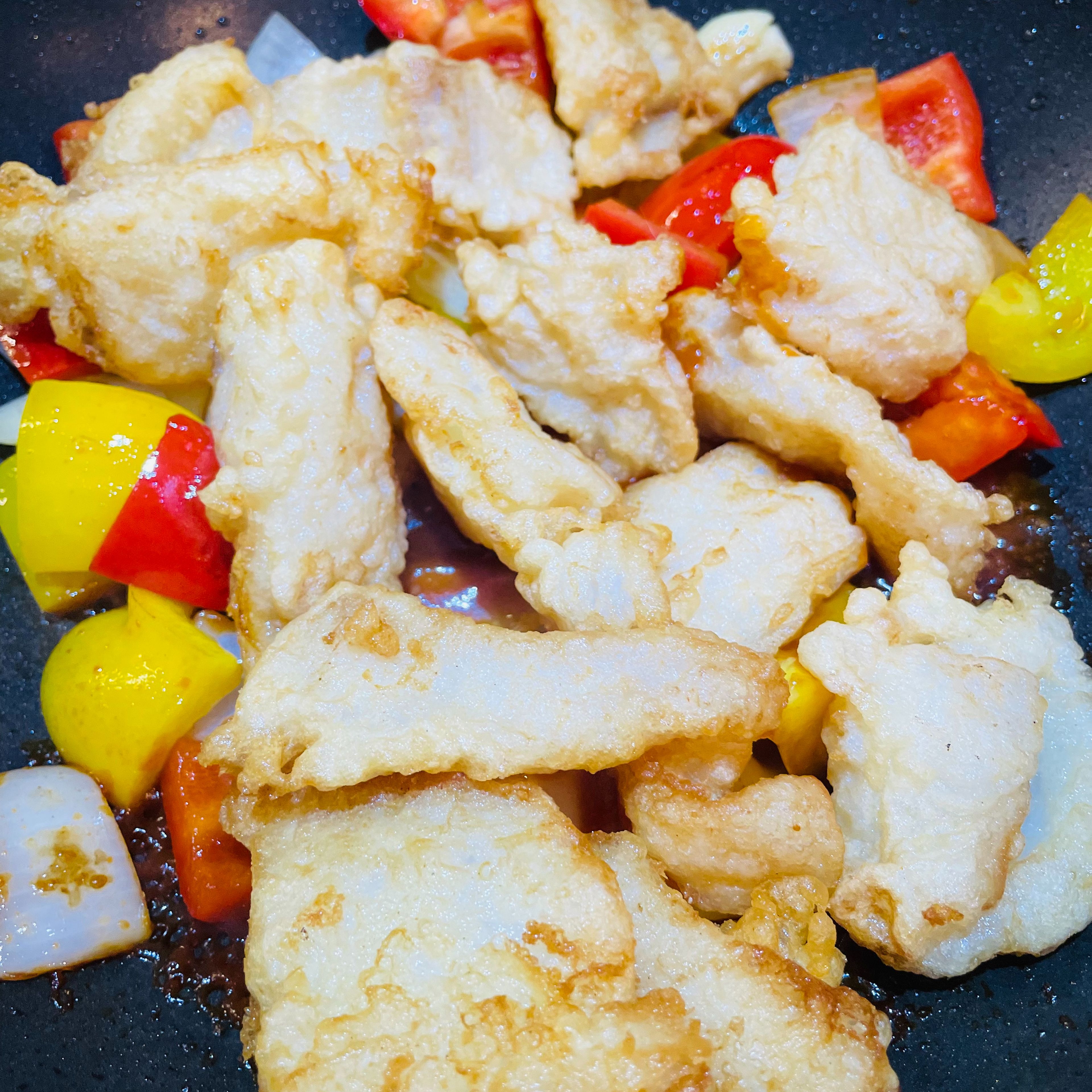 Put back fried fish to the pan and mix it well 