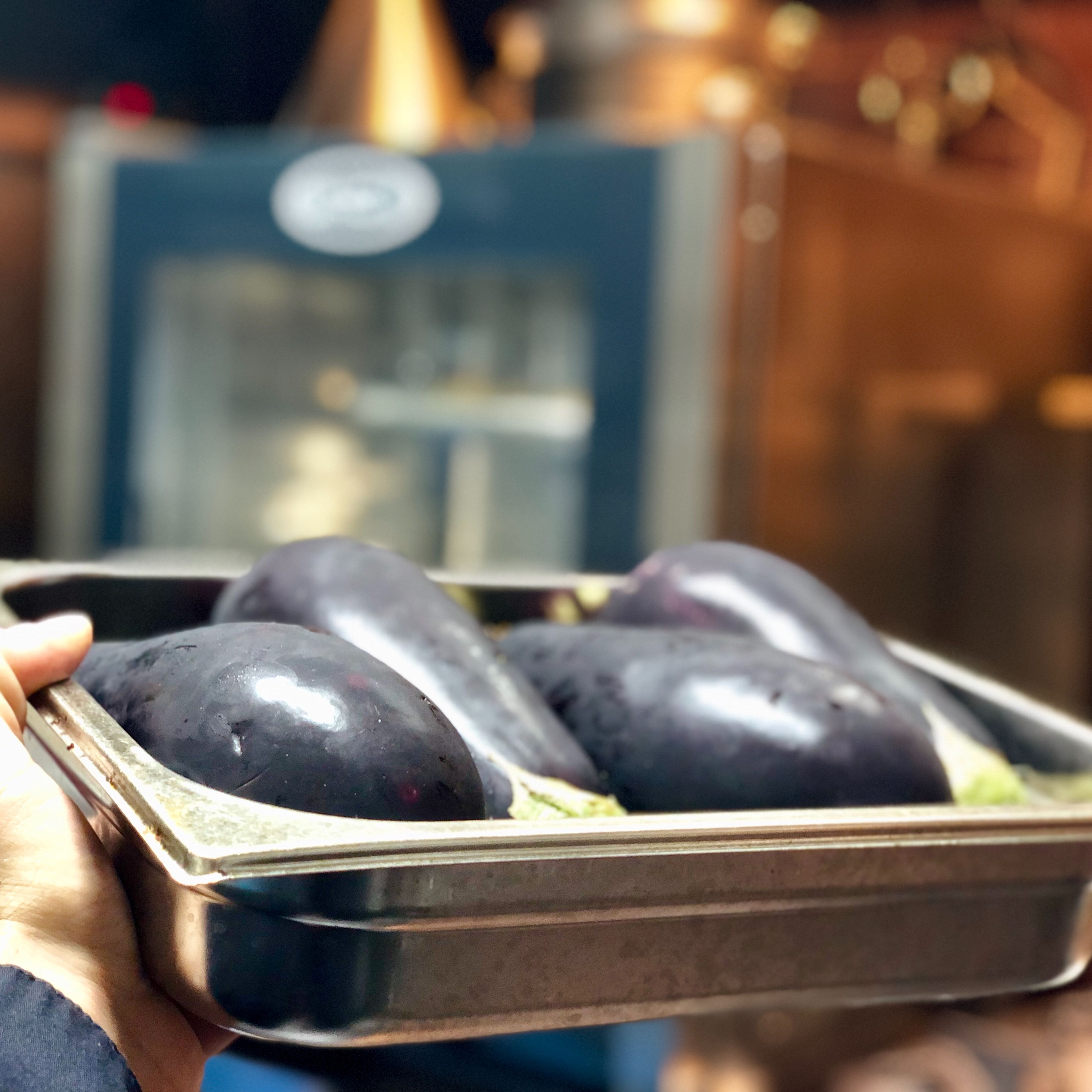 Preheat oven to 200 degrees C. Pierce the eggplants a few times with a fork to vent. Roast for about 50 minutes. Take out of oven and let it cool for 10 minutes. When the eggplants are cool, cut off the top and peel off the skin.