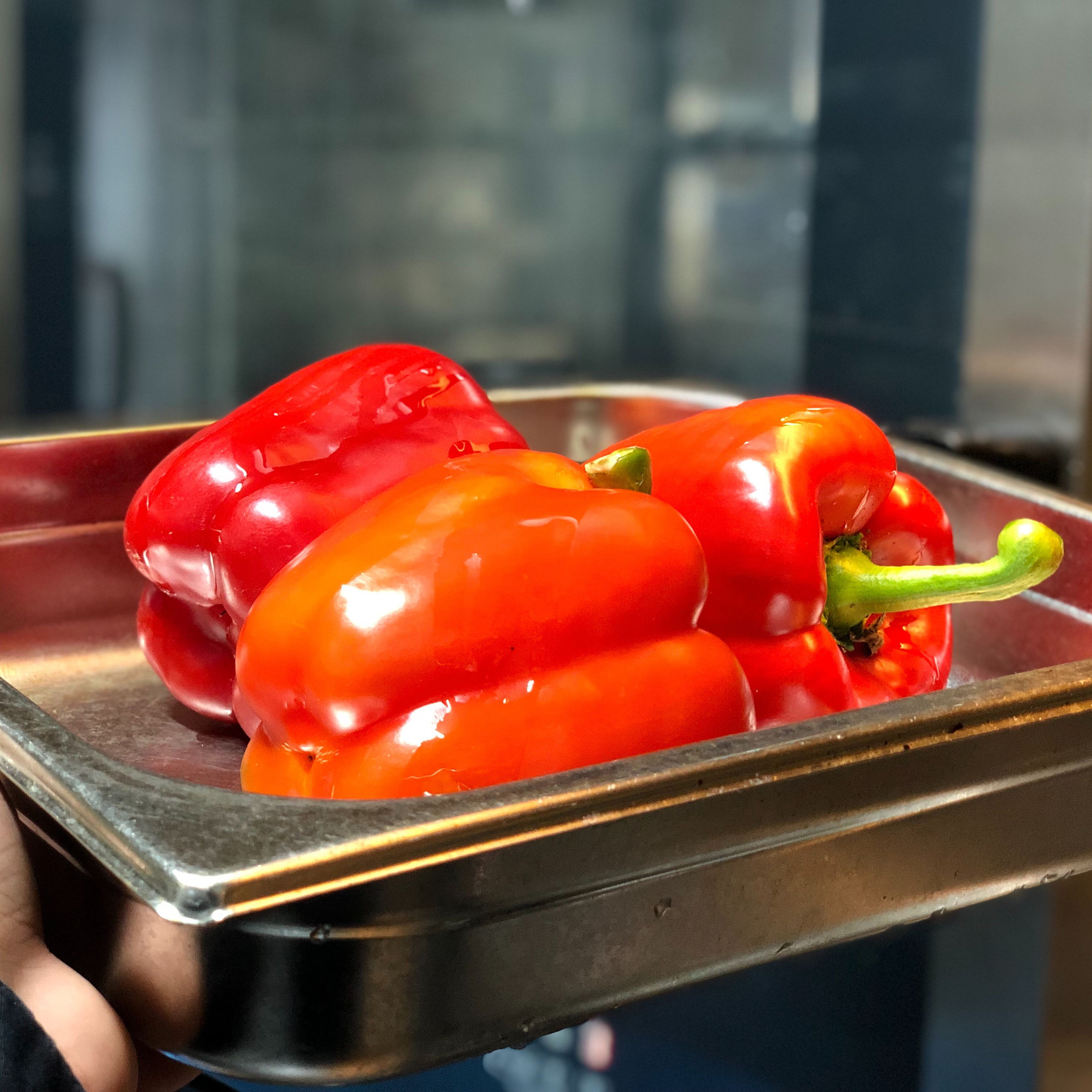 Preheat oven to 200 degrees C. Rub oil on peppers and put them in the oven to roast for about 30 minutes. Take out of the oven when it’s roasted and let rest for 15 minutes.