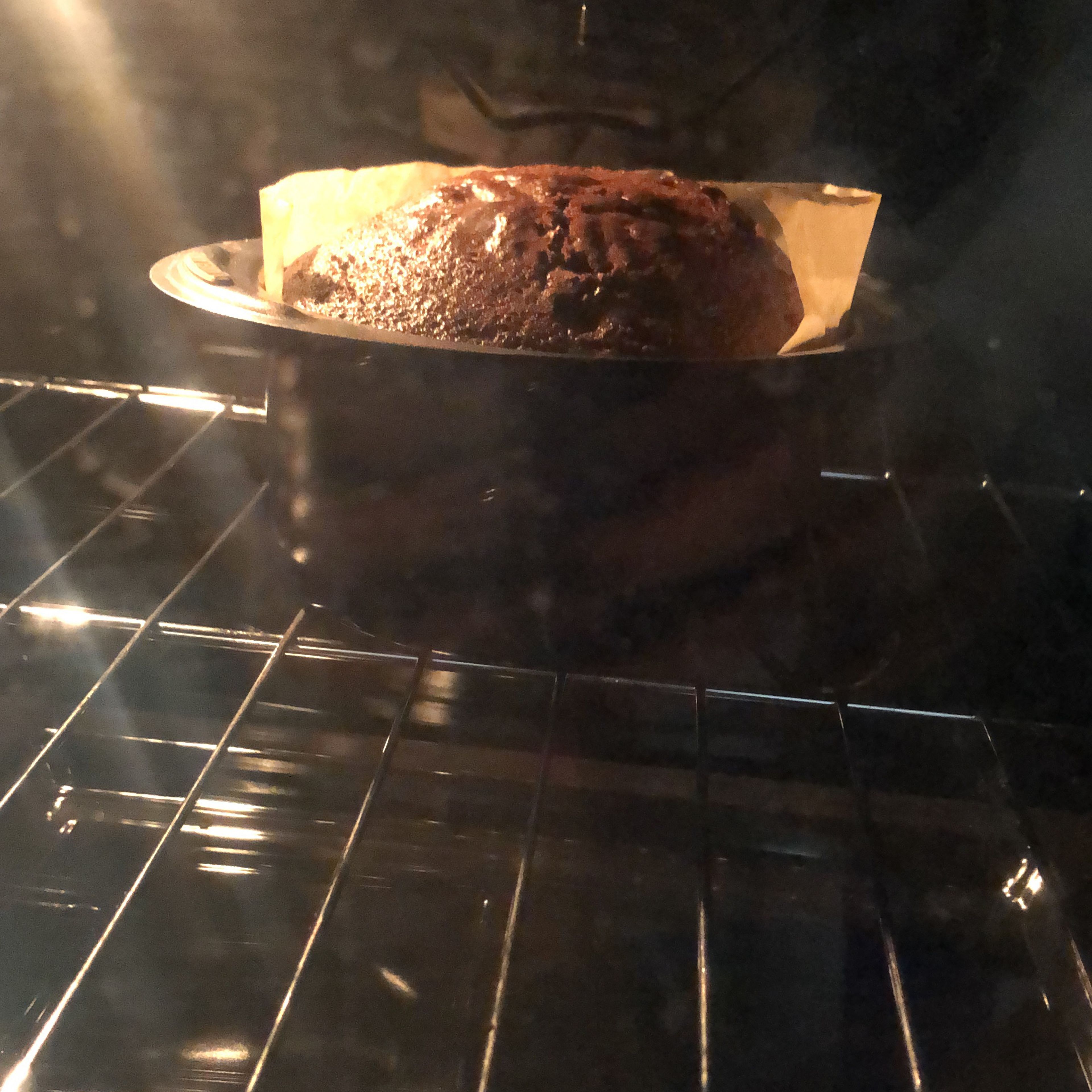 After 30 mins, take a toothpick or a knife and poke inside the cake to see if any cake batter is sticking to it. If cake batter sticks then let the cake bake for another 10 mins, if not switch off the oven and let the cake sit inside the oven for 5 mins to form a lovely glossy crust.