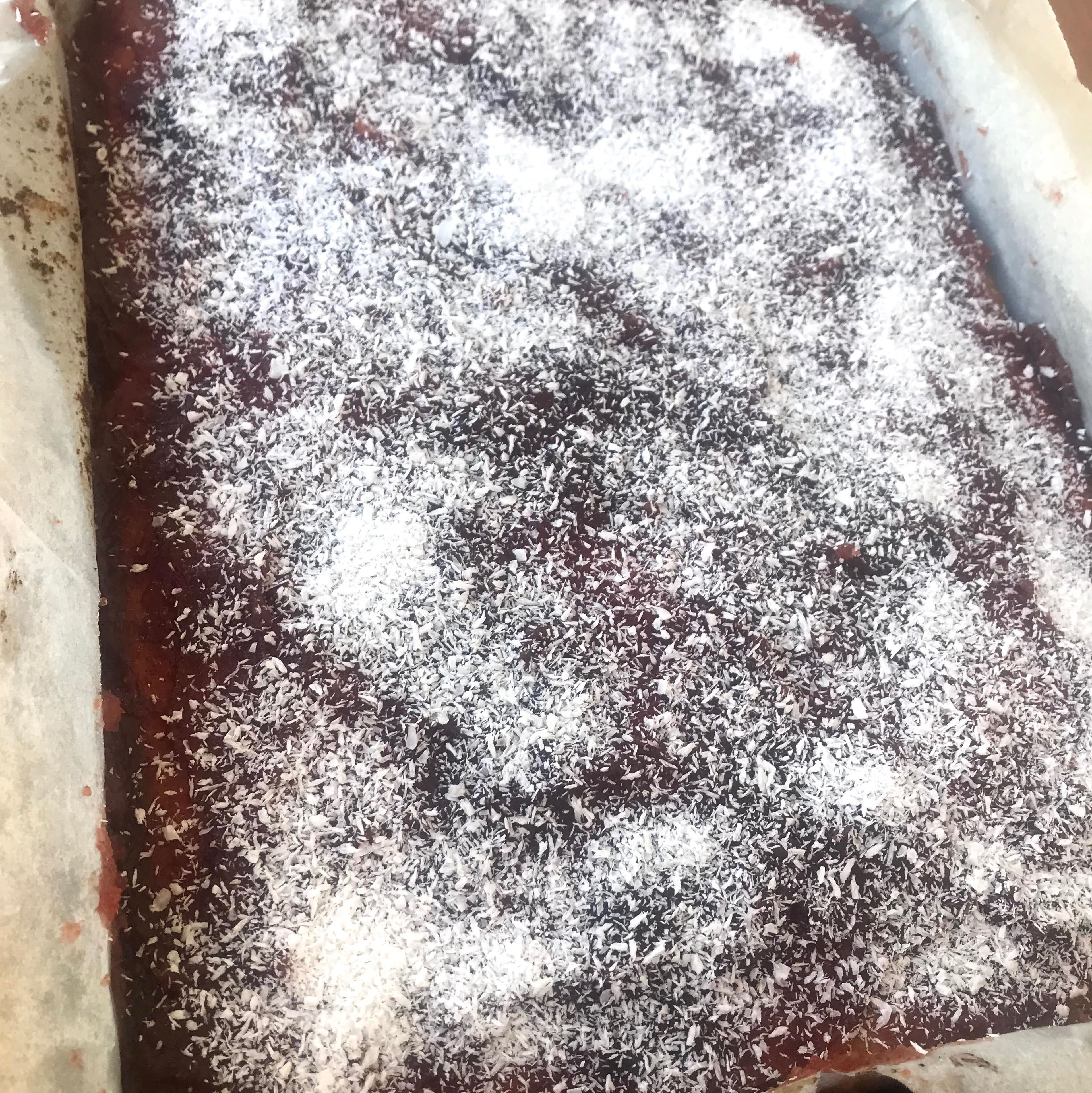 When ready take out of the oven,spread the jam over the top of the warm sponge and sprinkle with coconut.