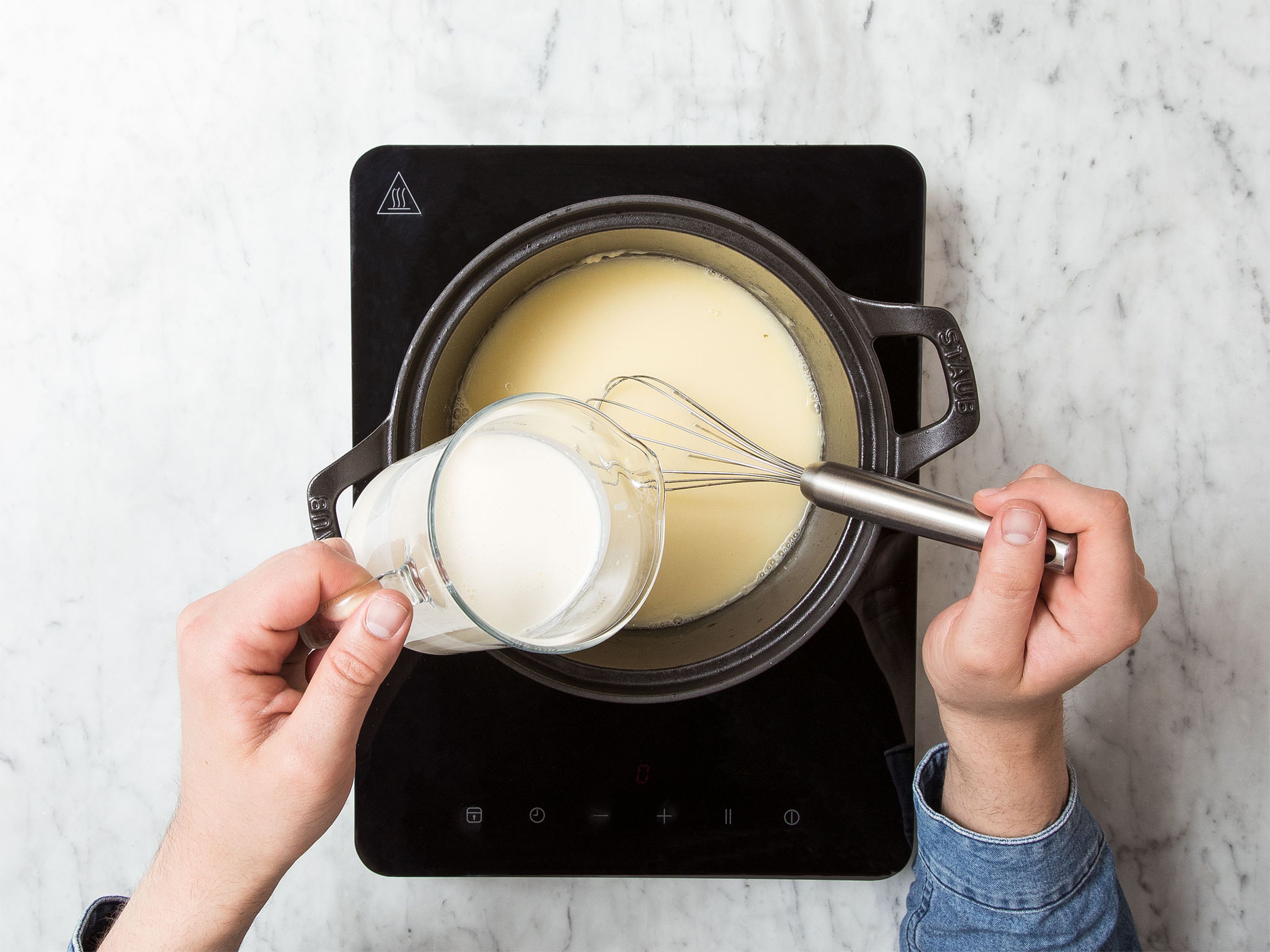 Melt two-thirds of the butter in a pot over medium-low heat. Stir in flour, then add white wine, vegetable broth, and heavy cream and whisk to combine. Season with salt, pepper, nutmeg, and sugar to taste. Let simmer over medium heat for approx. 5 min. while whisking.