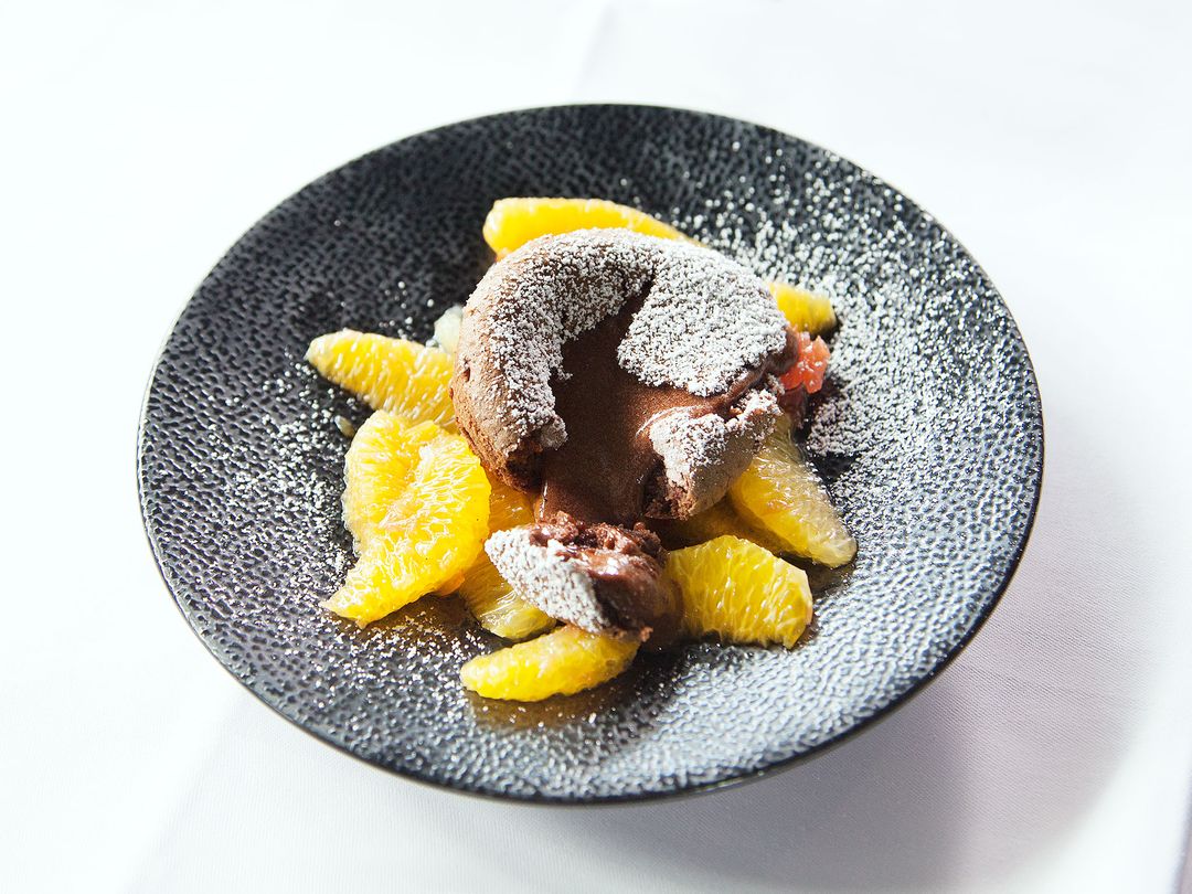 Molten chocolate cake and mulled wine citrus salad