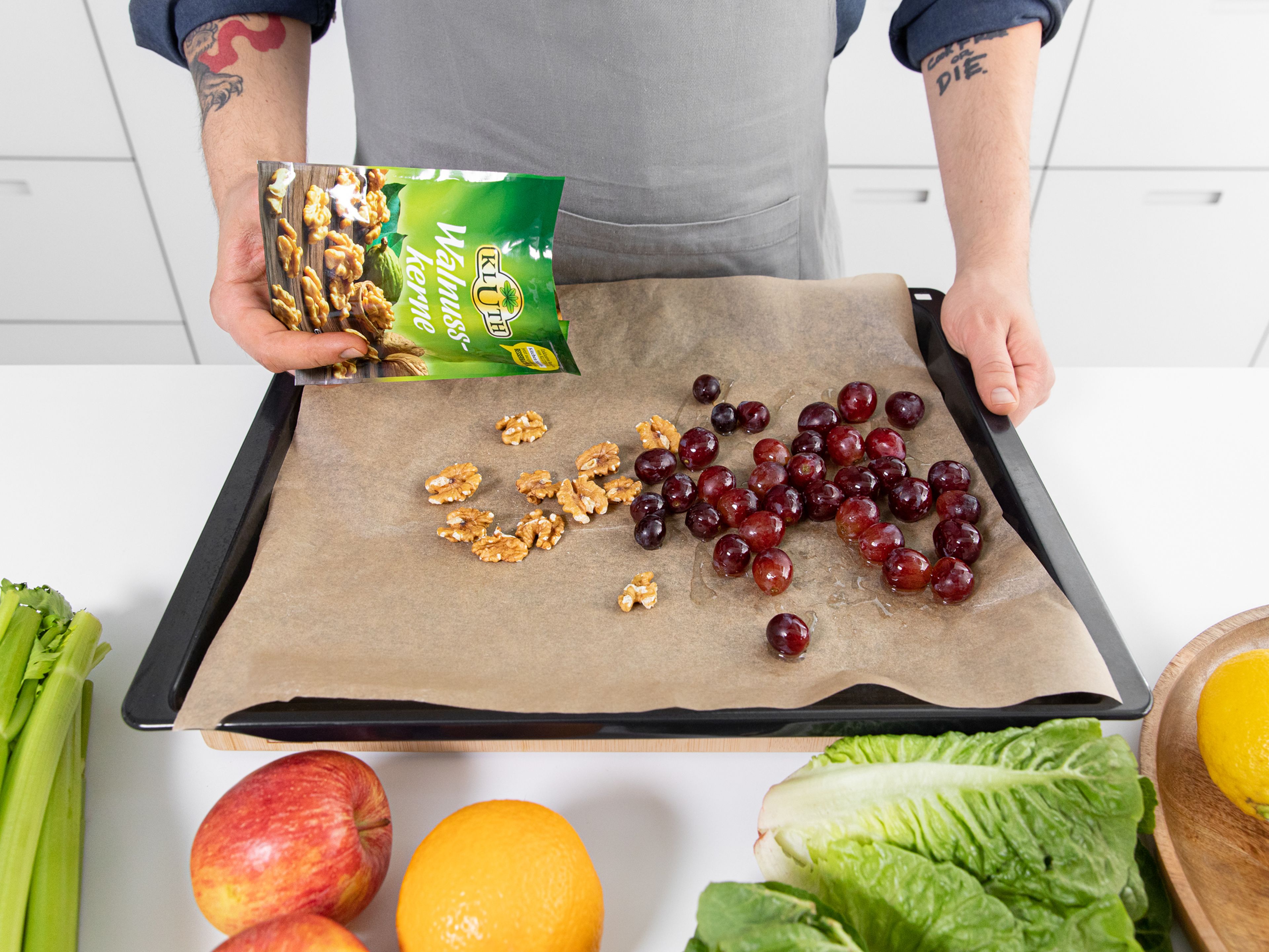 Preheat the oven to 180°C/350°F. Line a baking sheet with parchment paper. Toss grapes, olive oil, salt, and pepper in a bowl, until well combined. Add to half of the baking sheet. Add the walnuts to the other side. Let walnuts roast for 5 - 8 min., or until browned, then remove. Continue baking the grapes until caramelized, approx. 15 min. in total.