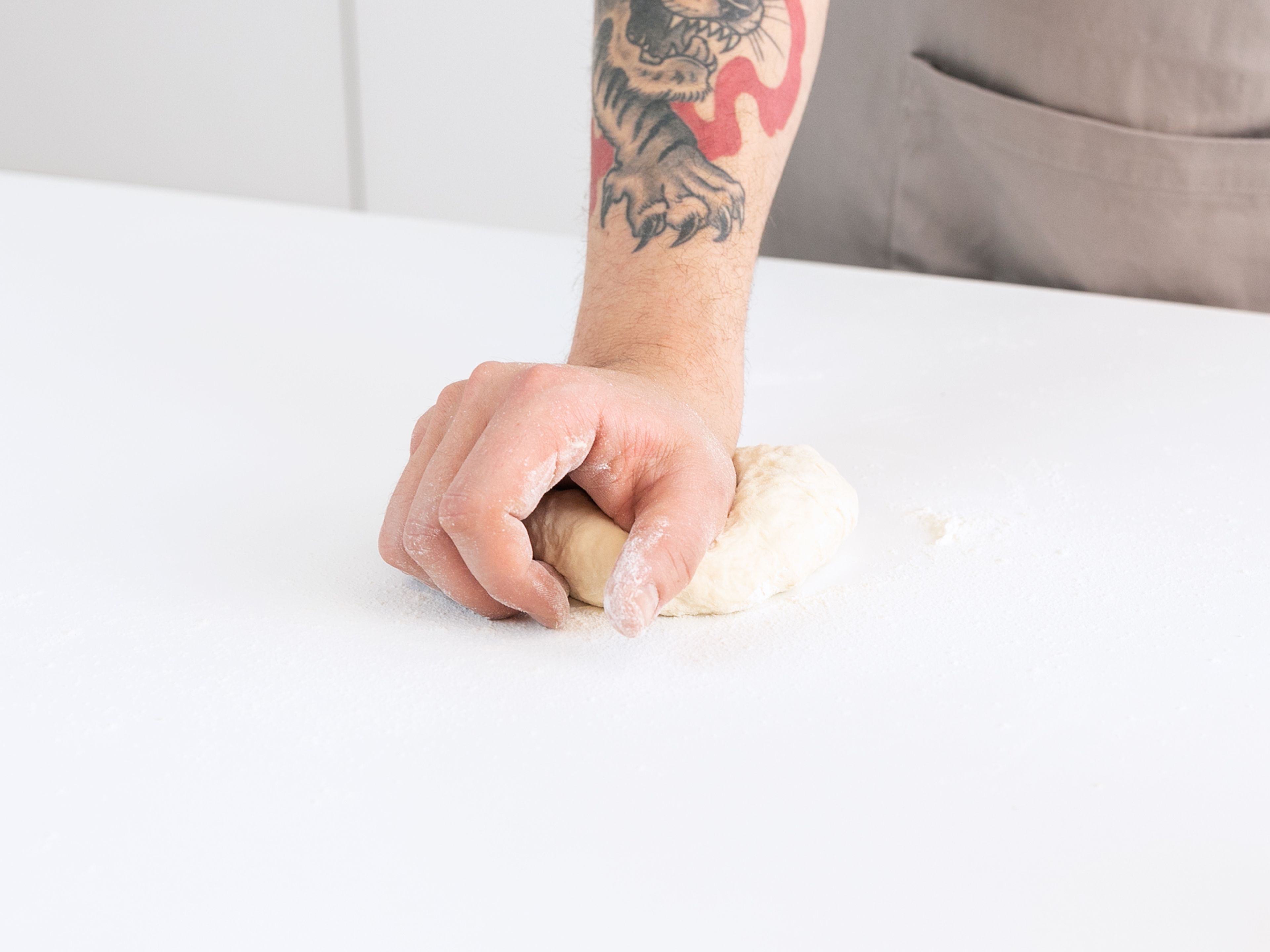 Knead rested dough on a lightly floured work surface for about 3 min., then cover with a clean kitchen towel and let rest at room temperature for at least 2 hr.