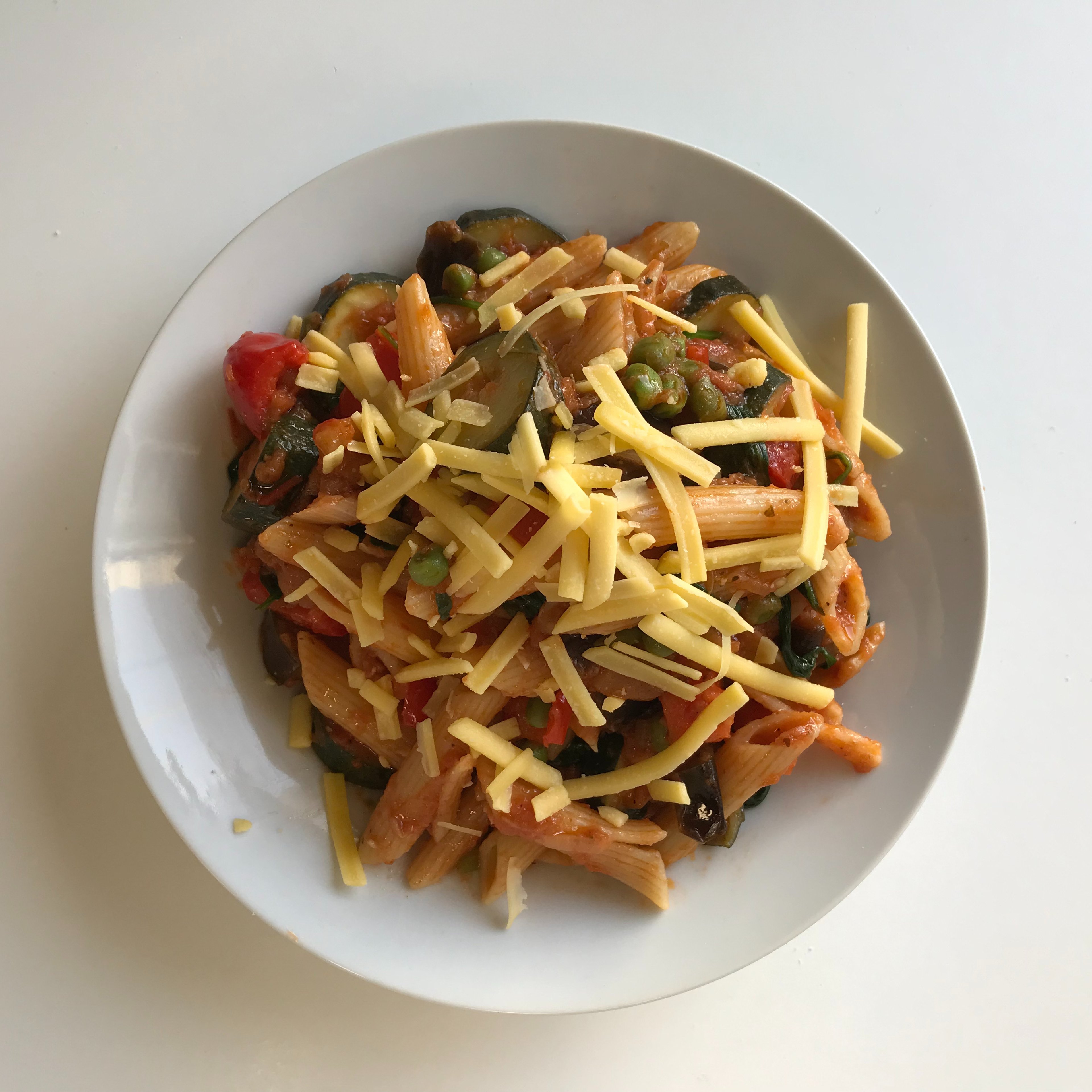 Pasta with vegetables in olive oil & tomato-based sauce