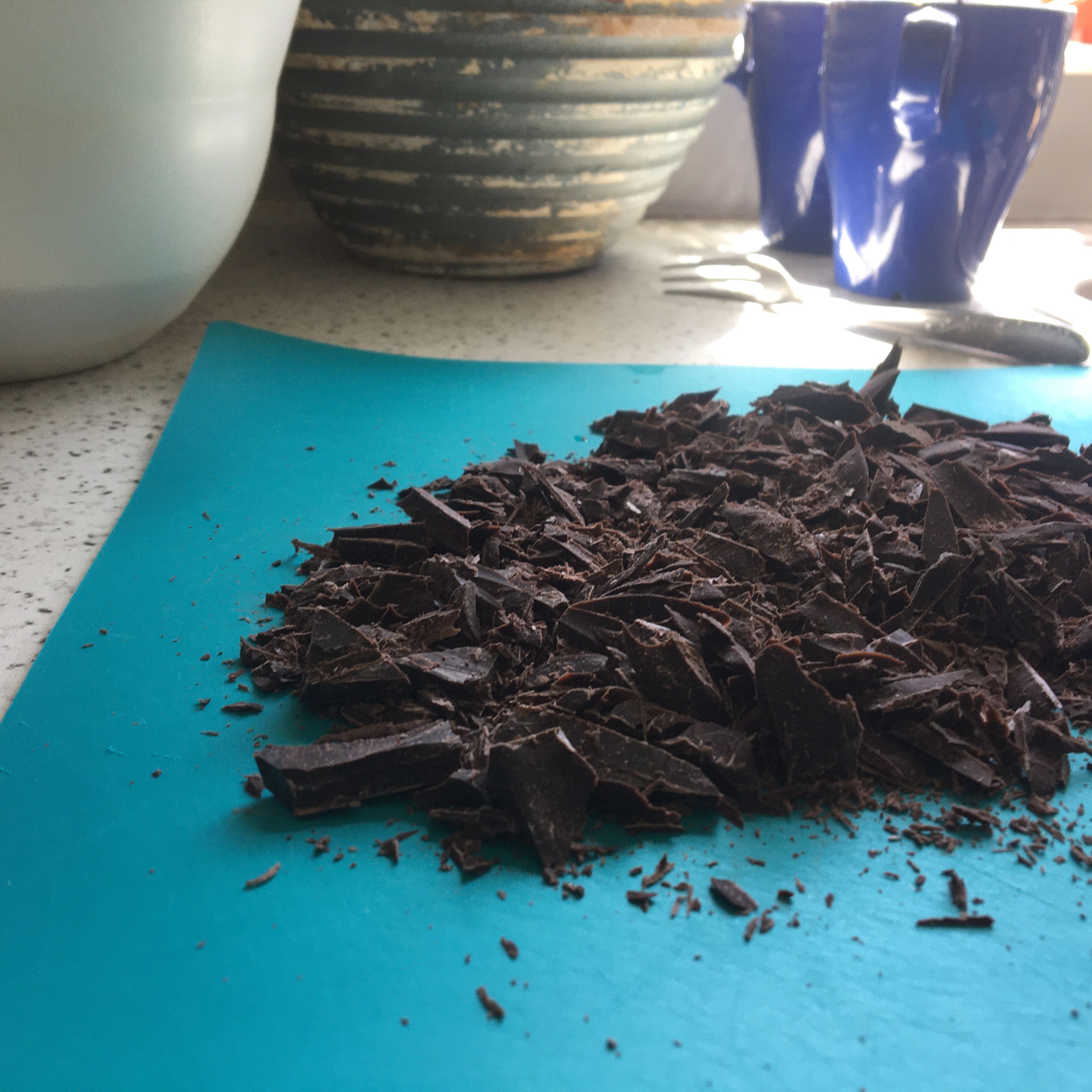 Chop the chocolate bar into chunks and set aside. Finely grate/shred the coconut piece with a zester or microplane. The store-bought shredded coconut could be easily replaced here. 
