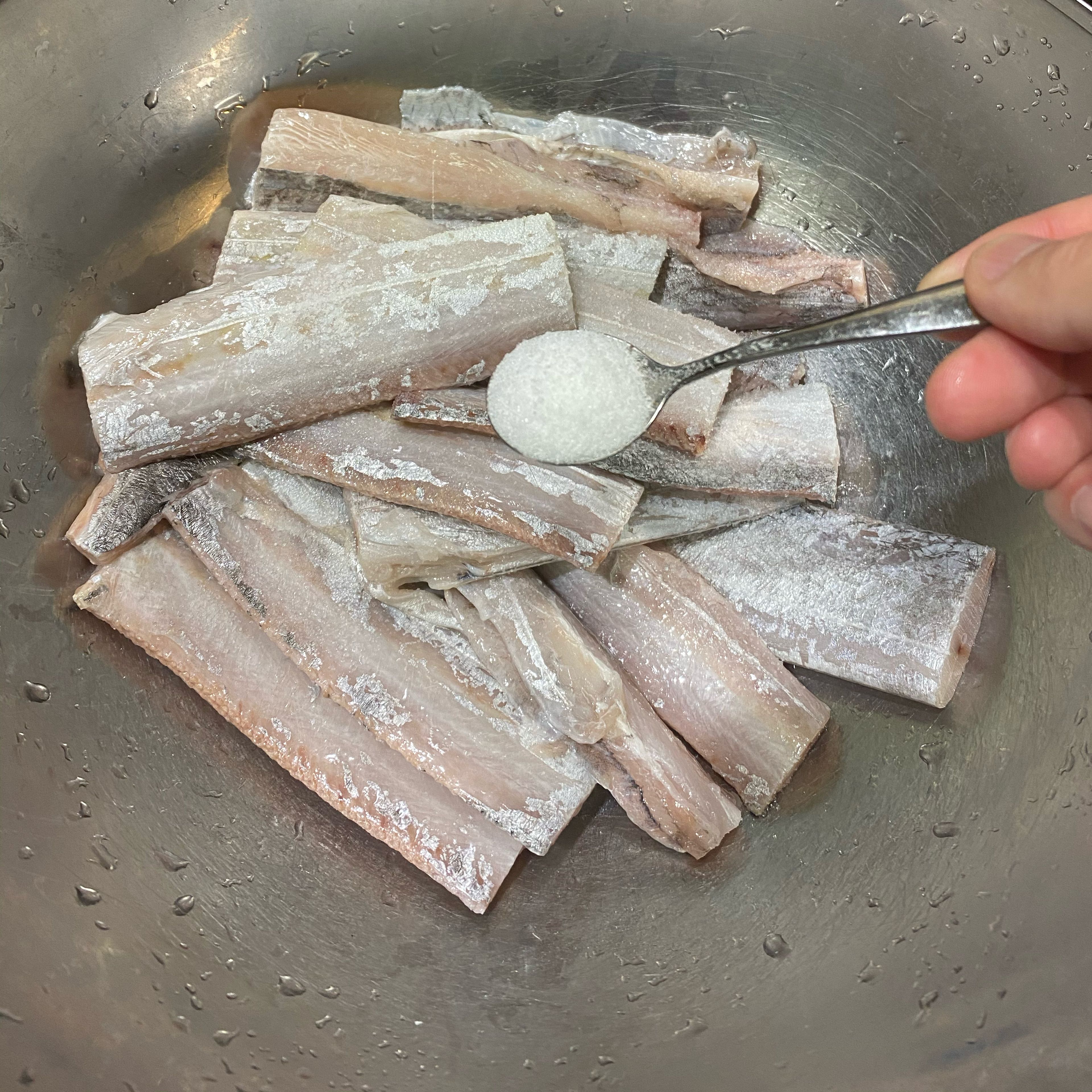 Pat fish dry and add salt, use your hands to rub and distribute the salt.