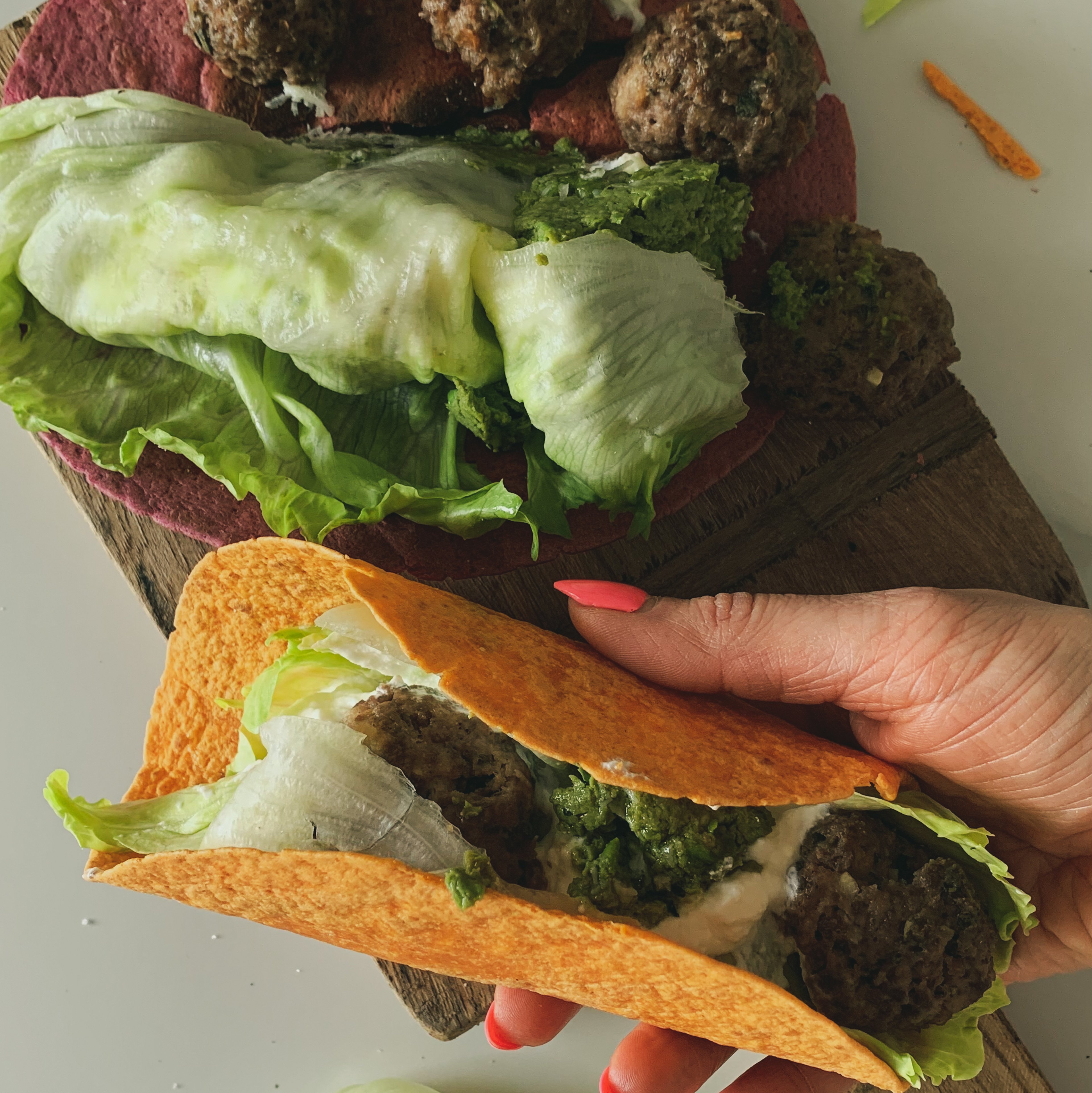 Herby Greek meatballs with pea pistachio pesto