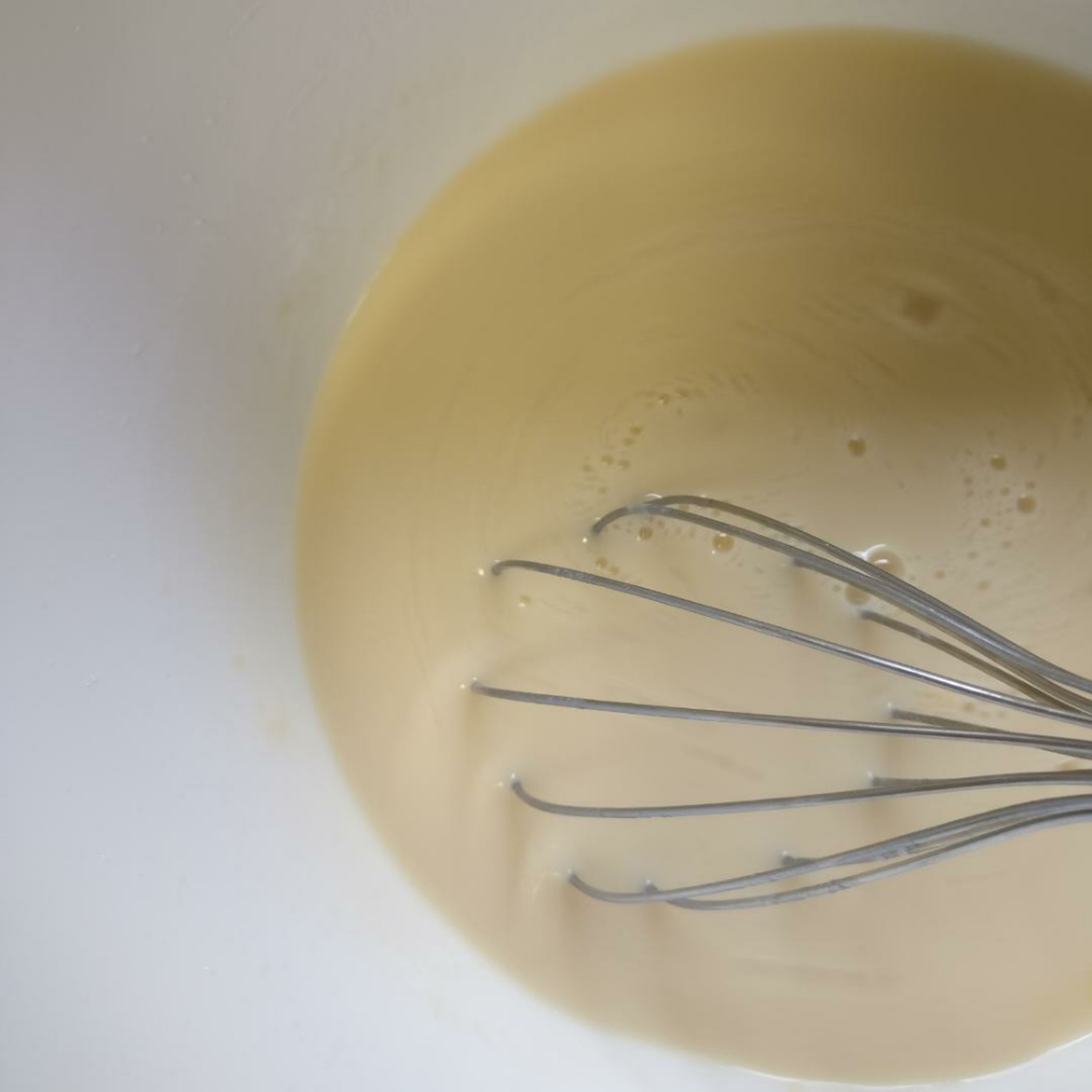 Mix Eggs, Sugar, Milk and Vanilla Extract in a bowl till it becomes like a pancake mixture.