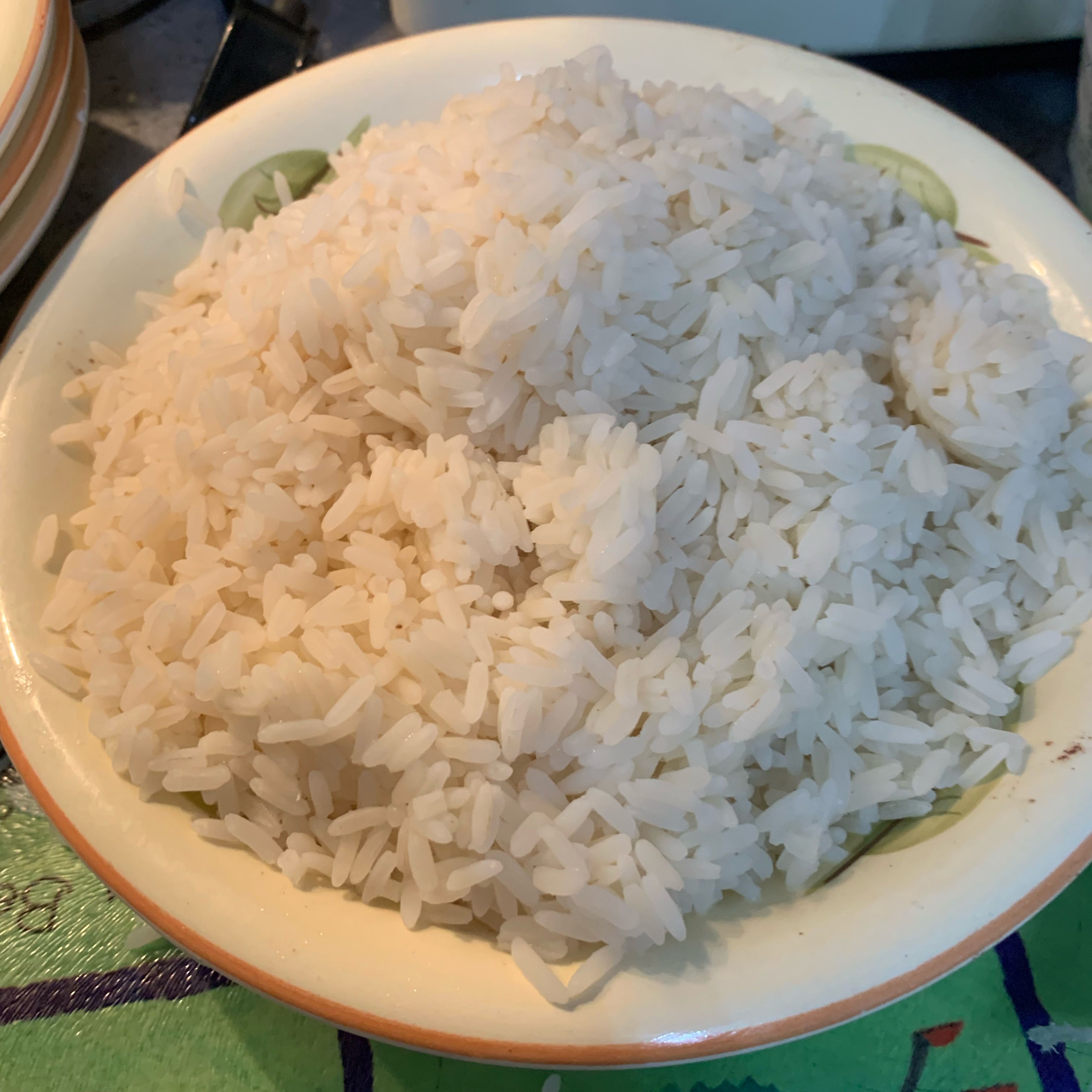 By this time the rice should be fully cooked. All you have to do is cut the bags open and get the rice out for it to dry out. You can season it with some salt, parsley or garlic granules - all depends on your preference. Dish up the rice on 4 separate plates/bowls. 