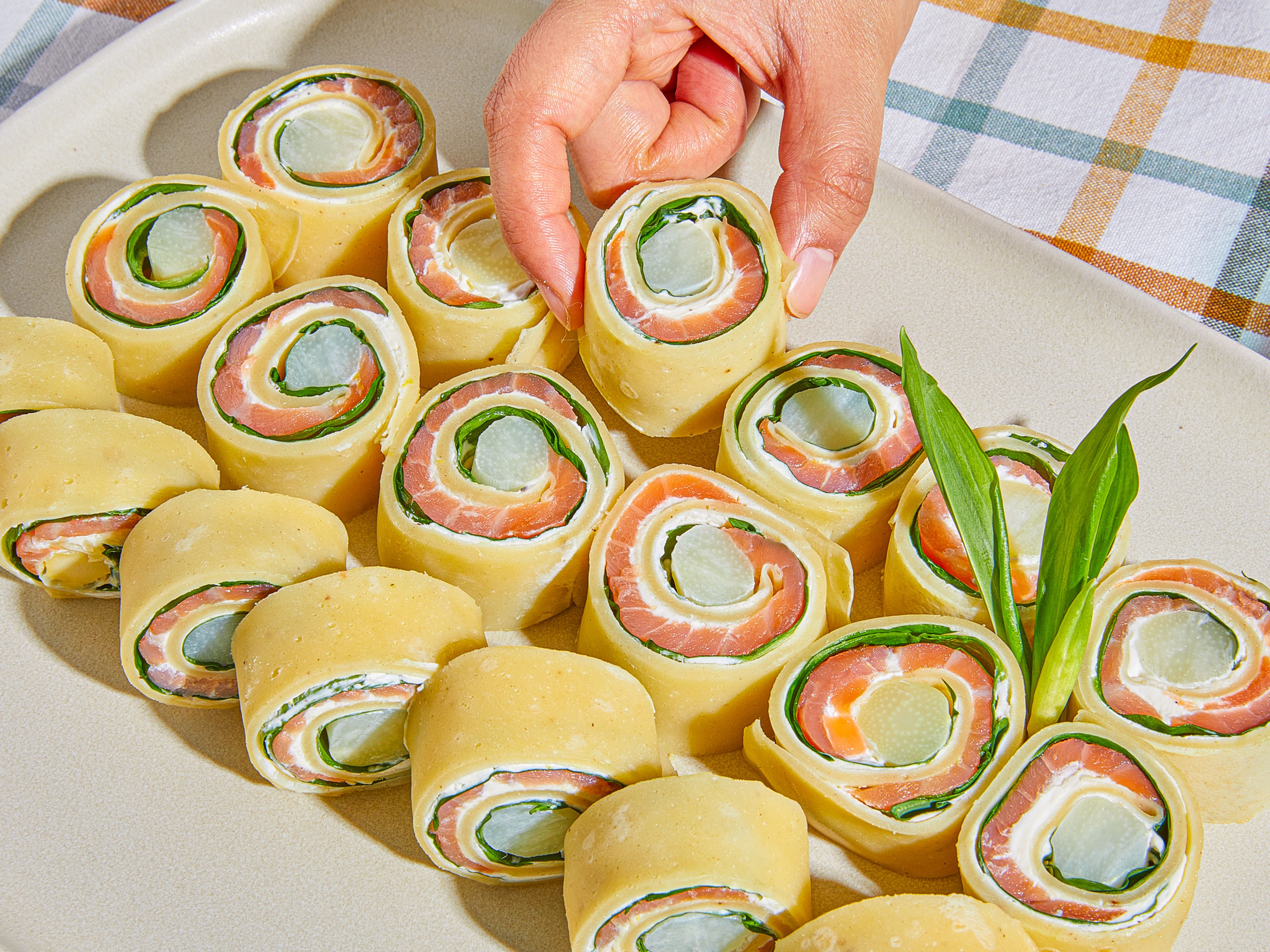 Wild garlic, white asparagus, and smoked salmon crepe rolls