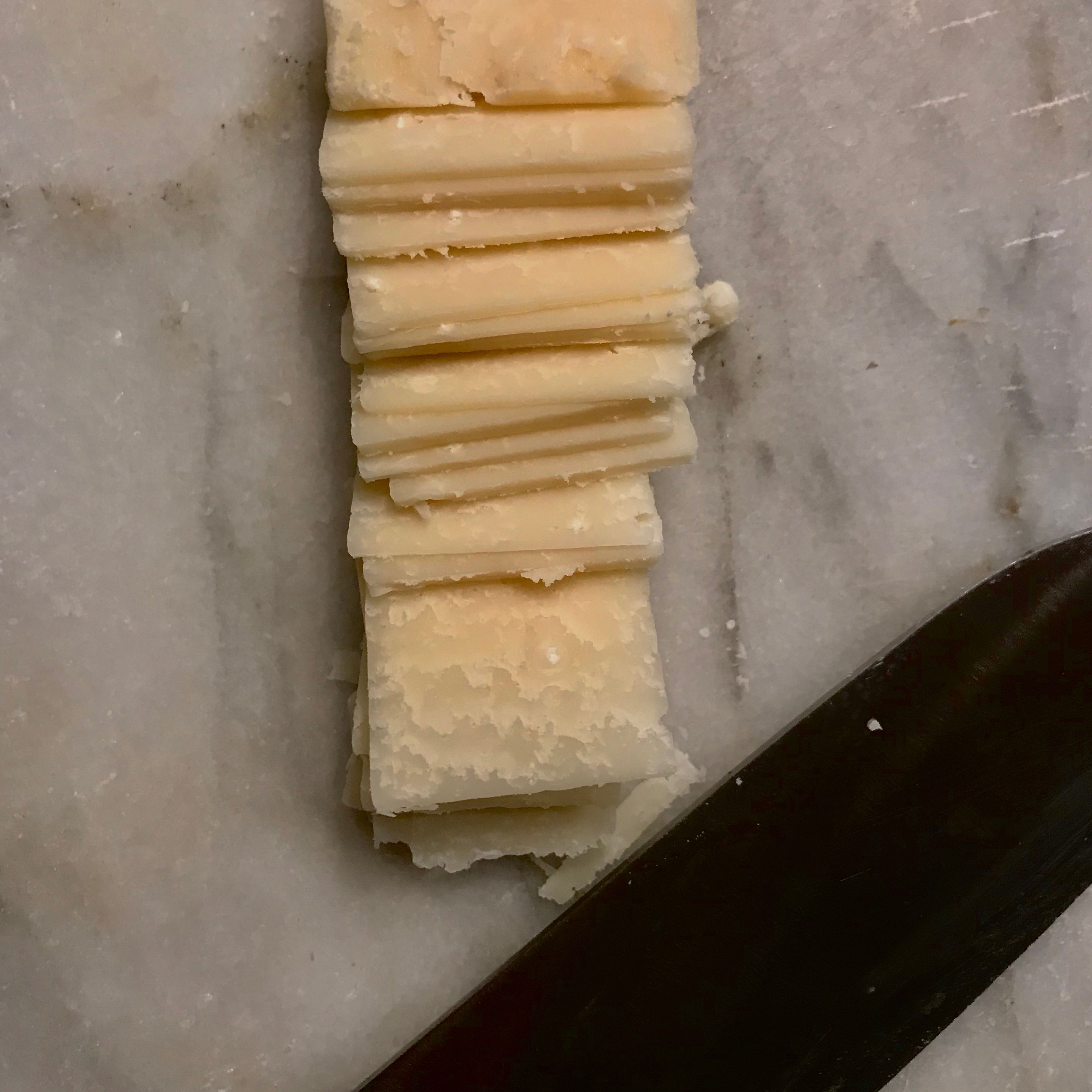 Cut the Parmesan into thin slices. 