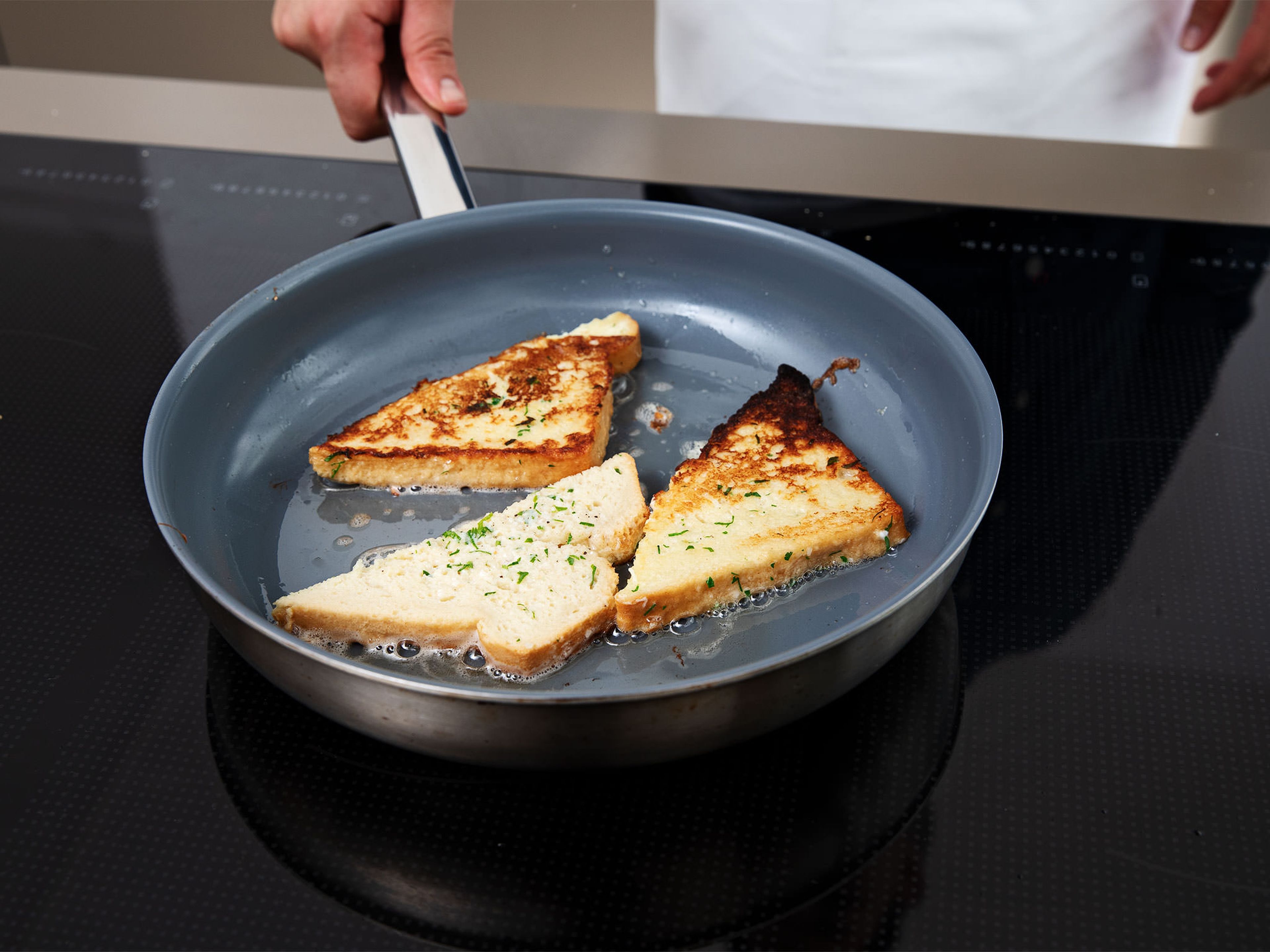 Add butter to a frying pan set over medium heat-high heat. Add bread slices to pan, and fry on both sides until golden. Season with pepper and serve straight away while hot. Enjoy!
