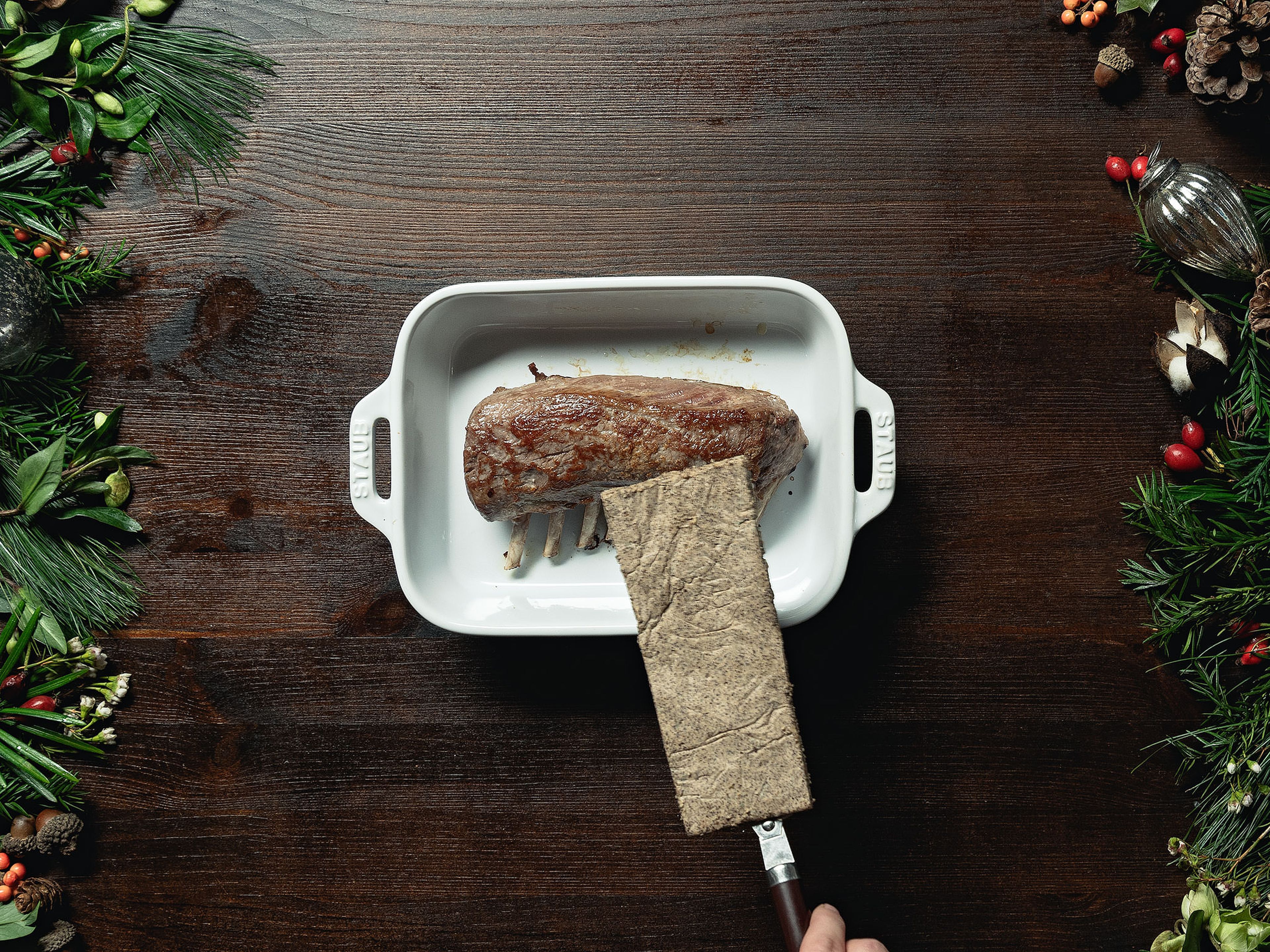 Cut the coffee crust to fit the rack of lamb and gently set onto the meat. Broil lamb on the highest grill function of the oven until the crust is set, approx. 3 min.