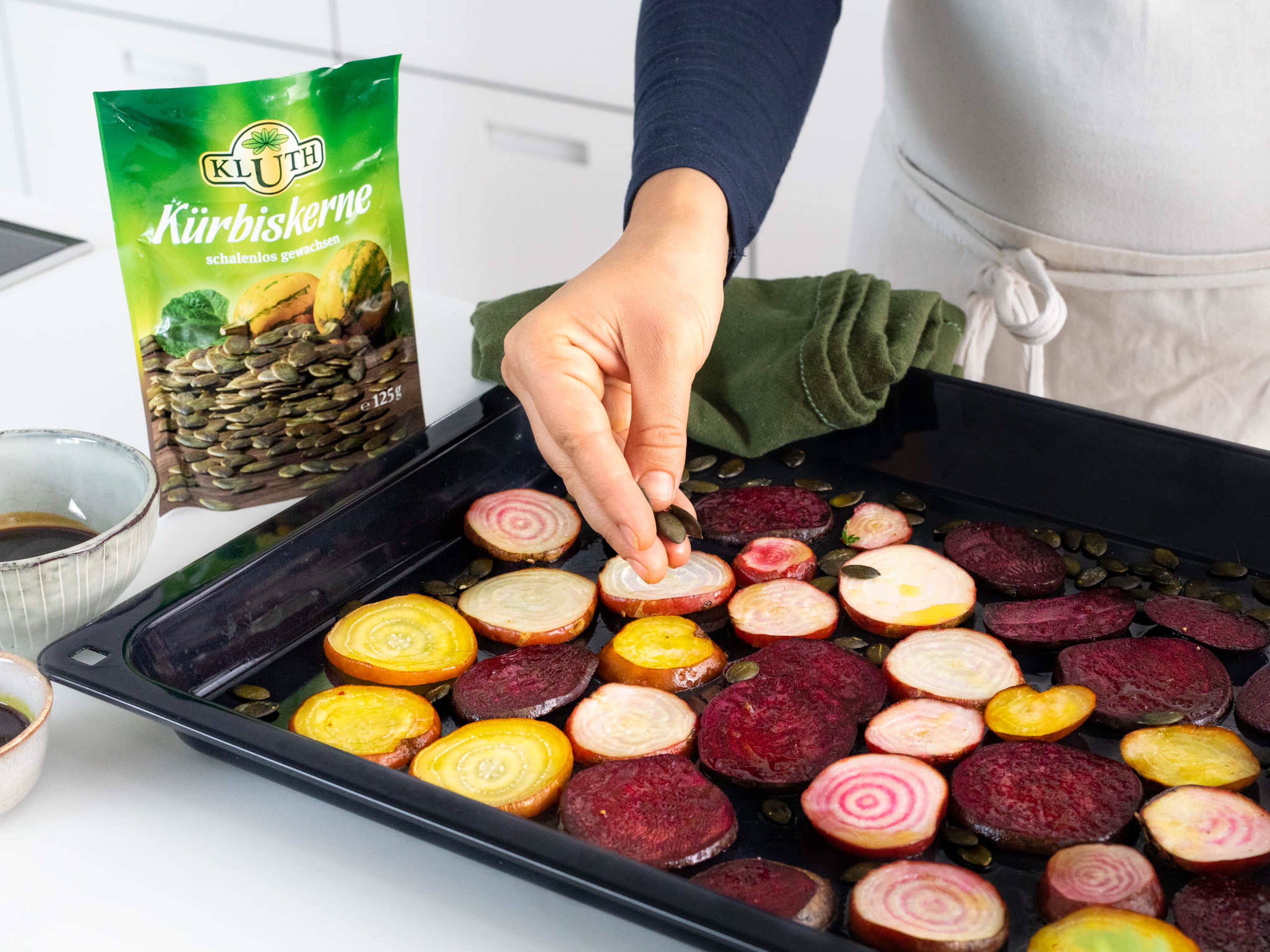 Approx. 8 min. before the end of the beet roasting time, remove the baking sheet from the oven and sprinkle with pumpkin seeds. Transfer back to the oven to finish baking.