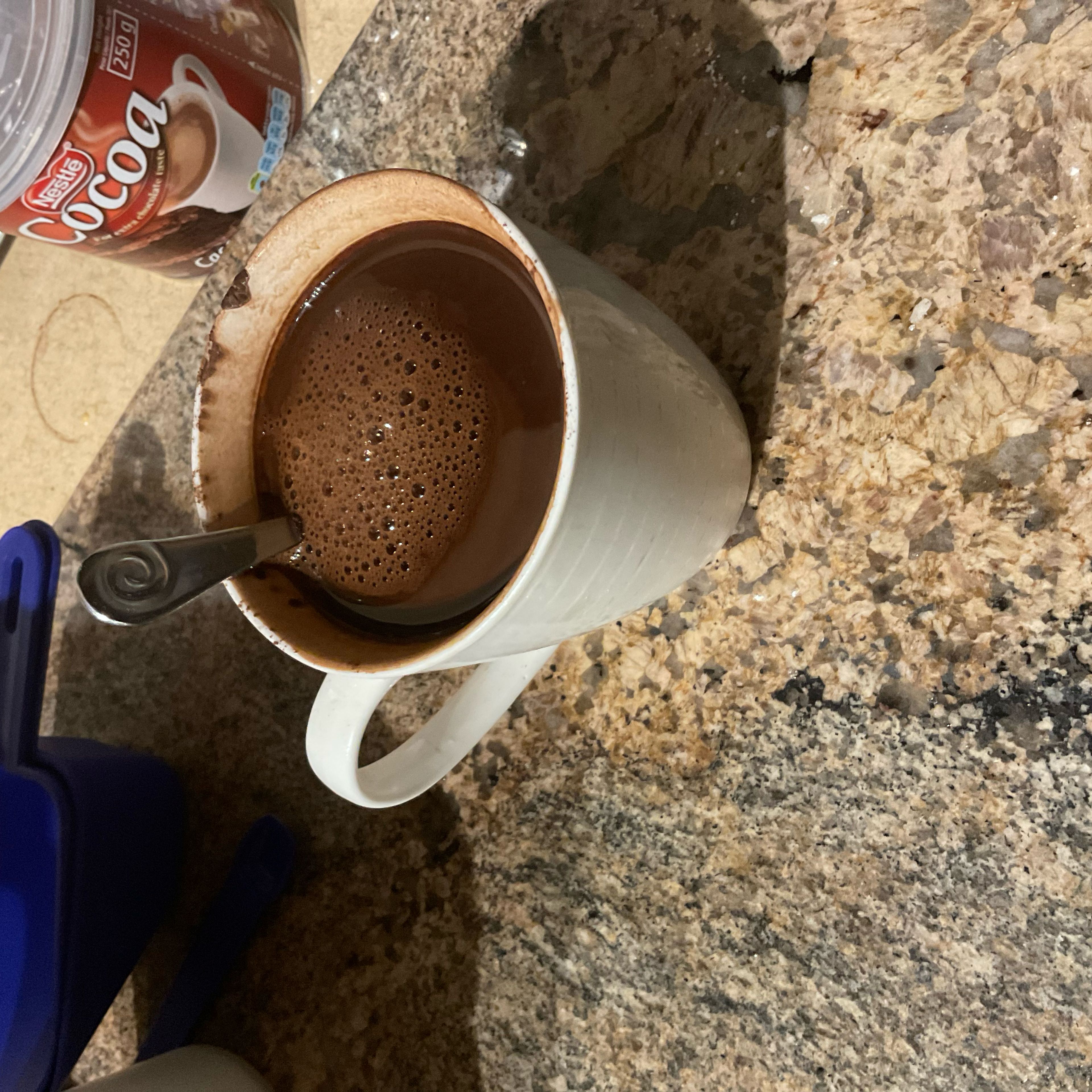 Add cocoa powder and coffee to a mug and add boiling water. Leave to cool.