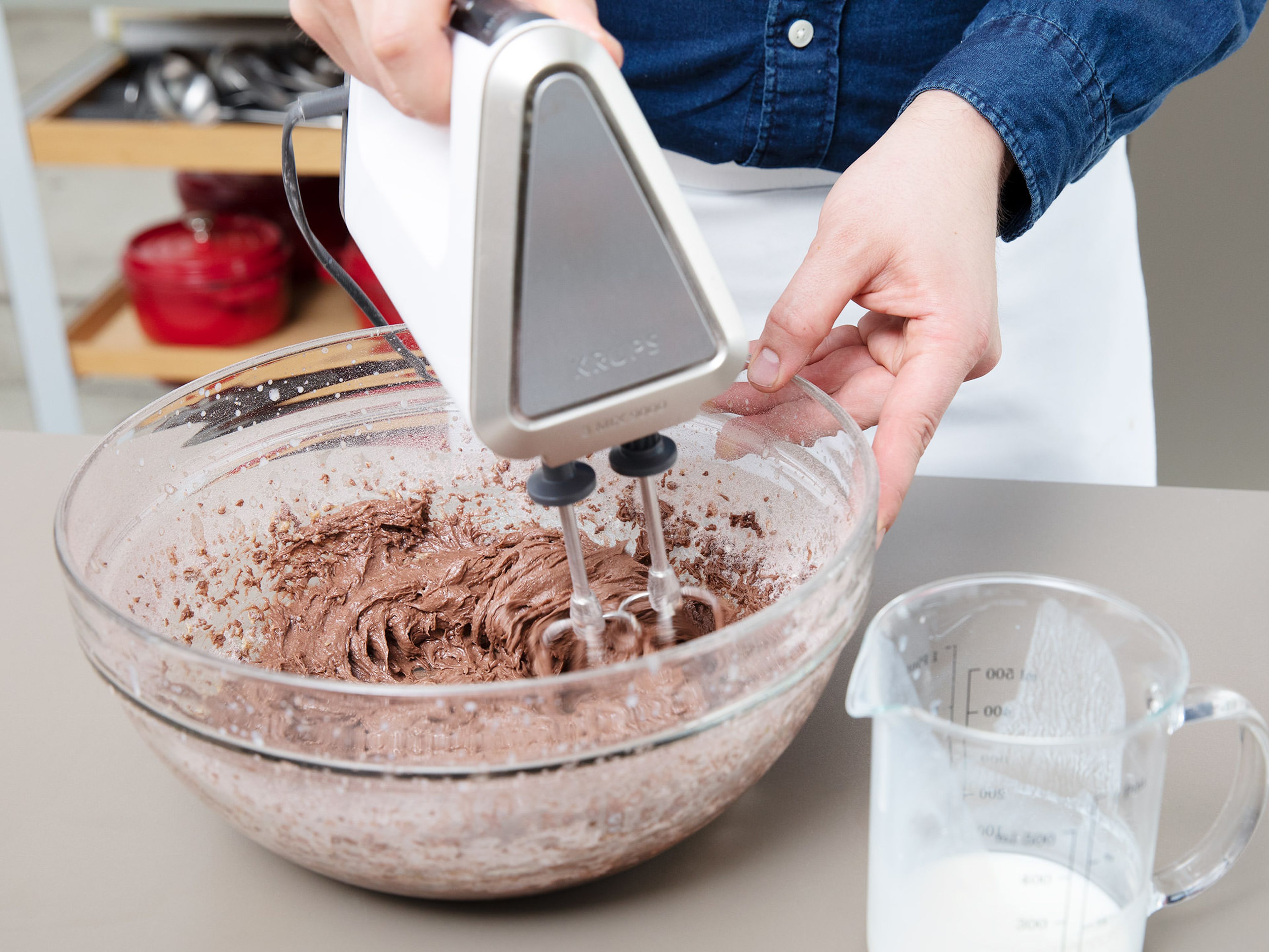 In a separate bowl, whisk together the flour, cocoa, baking soda, and salt. Add the dry ingredients to the butter-sugar mixture in three parts, alternating with the buttermilk, until everything is combined.