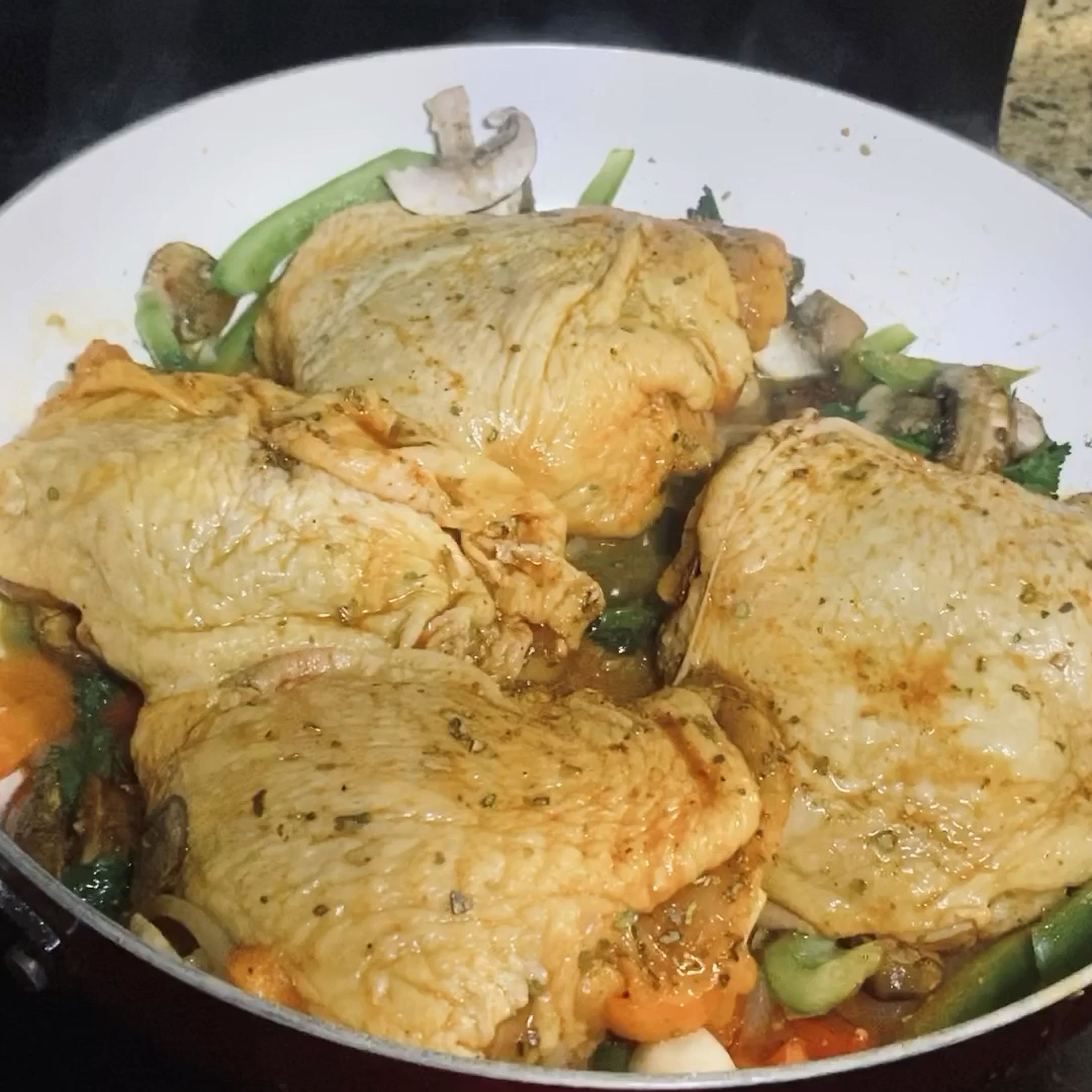 Season Chicken and place on top on Sautéed￼ veggies, herbs and spices. Cover and cook for 45 minutes until done with a golden tone.