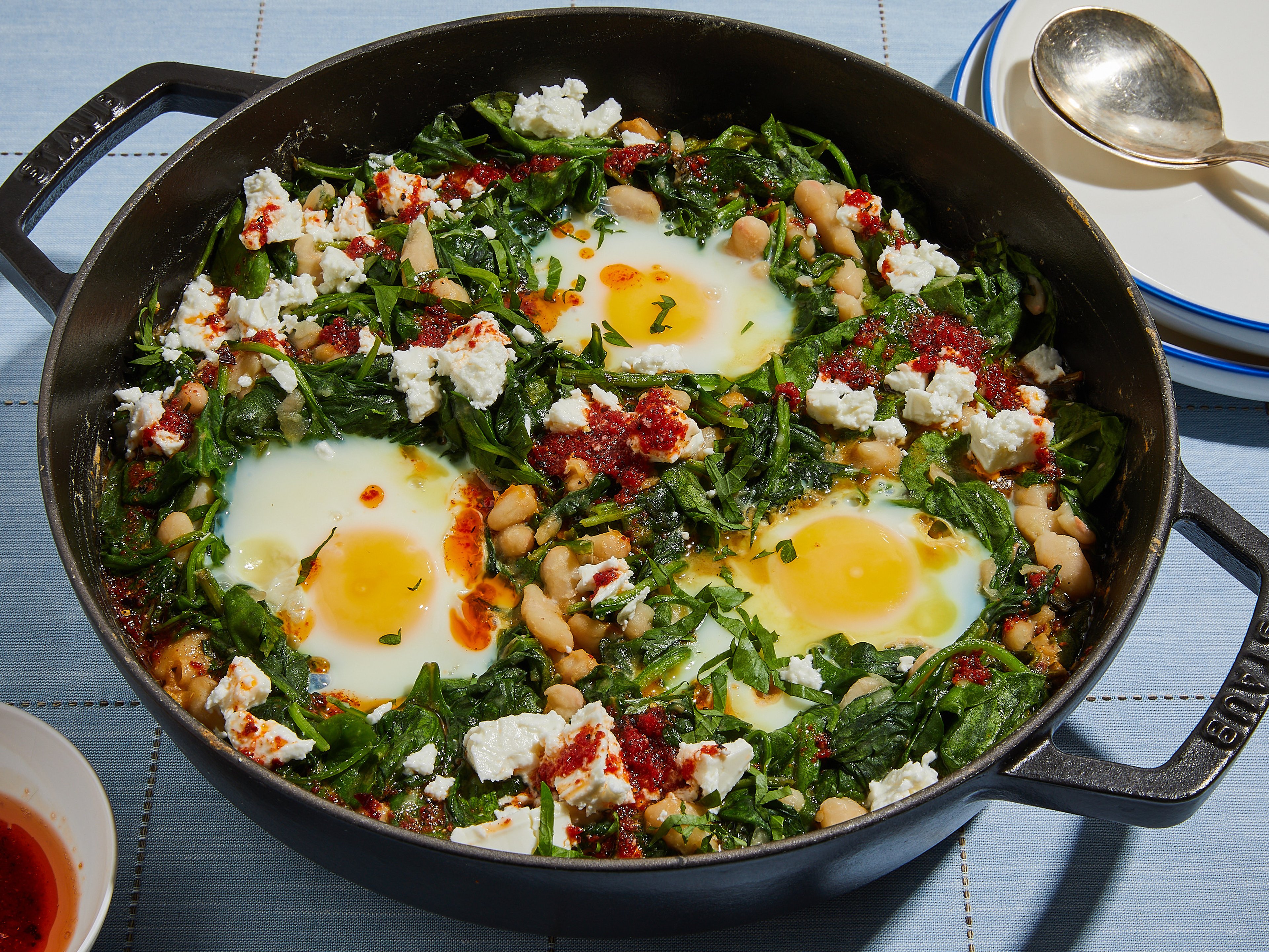 Green spinach shakshuka with white beans