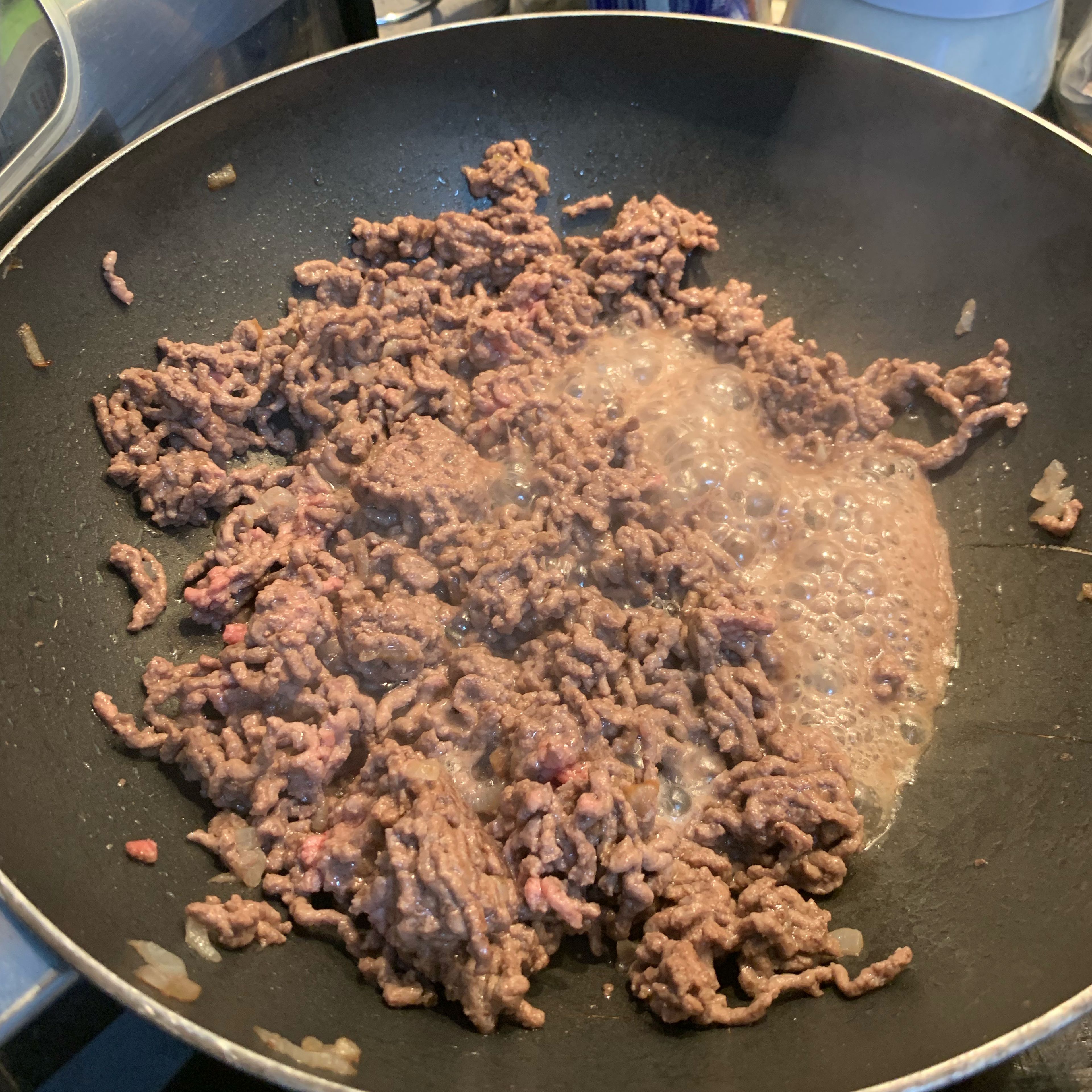 Throw the steak mince in the frying pan with the onion previously cooked. Cook till all nice and brown and no raw bits are showing. Add a stock cube mixed with 100ml of water (either a chicken or beef cube - both do a good job in making the meat flavours come out more and cook better).