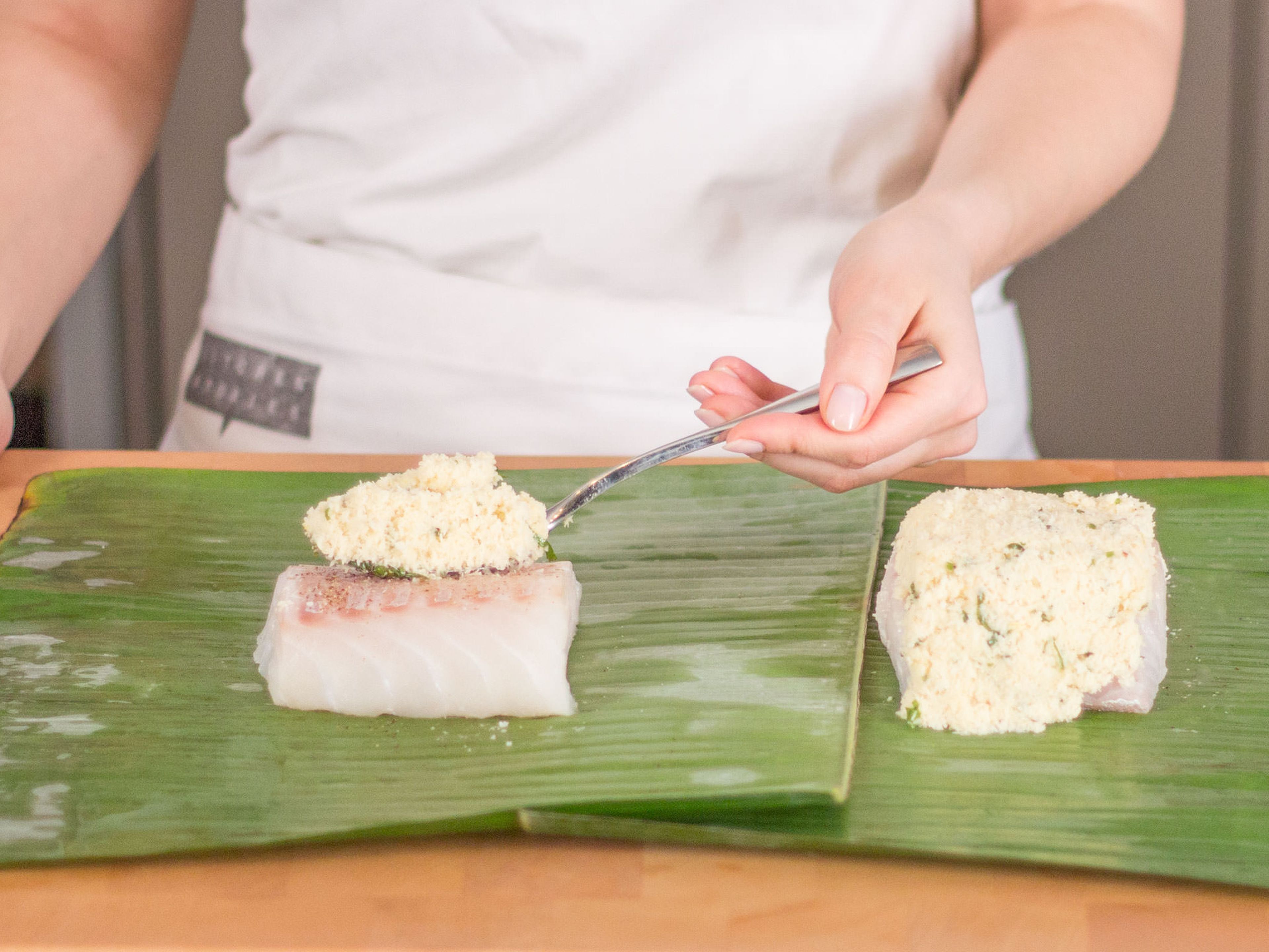 Season each cod fillet with salt and pepper and transfer to the middle of a banana leaf. Cover with coconut mixture.