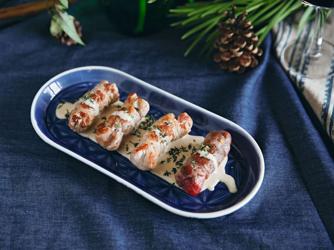 Involtini with apricot-cashew filling and spiced cream sauce