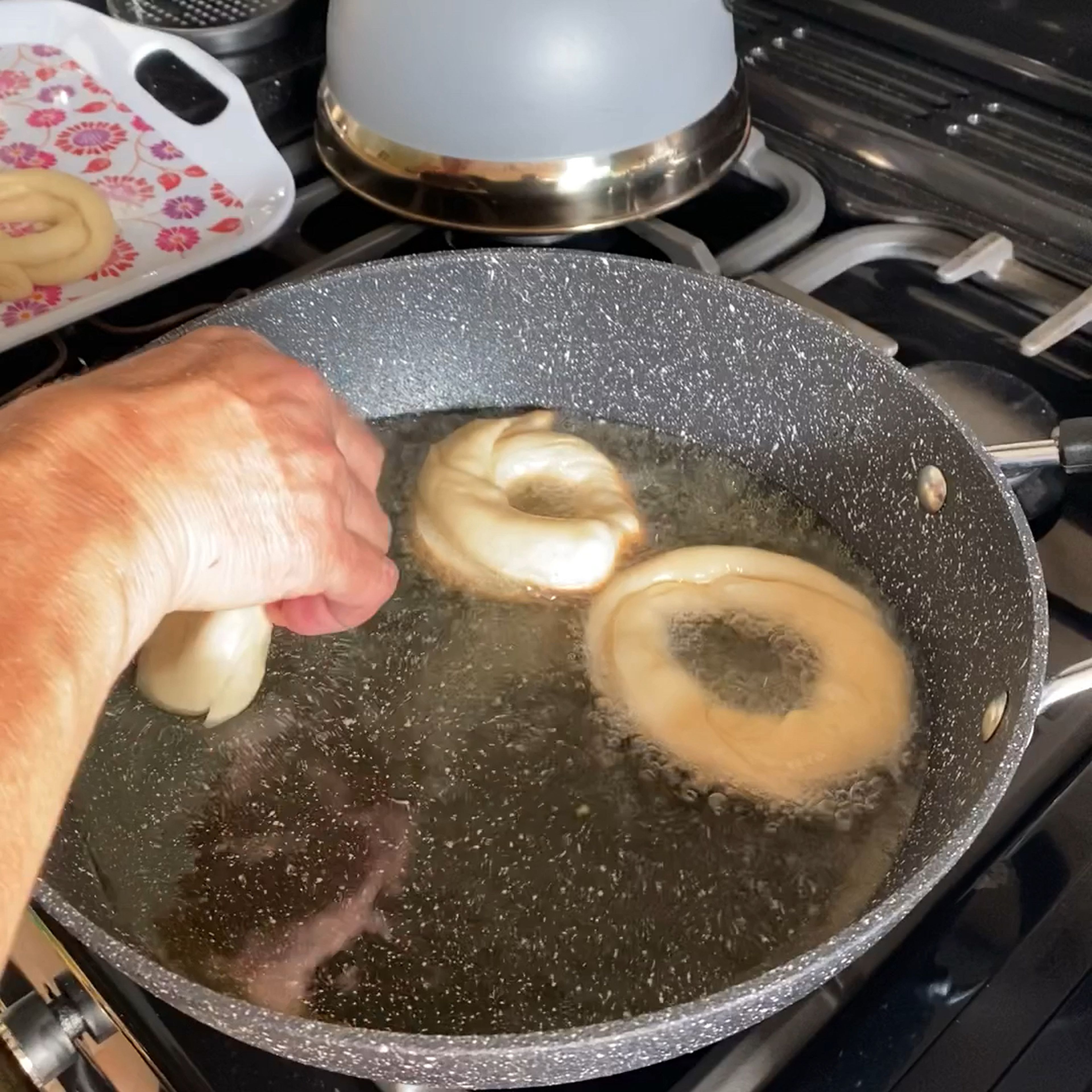 When ready start to deep fry until golden brown (it does require some practice to get them perfect) and coat with sugar (and cinnamon if you like)