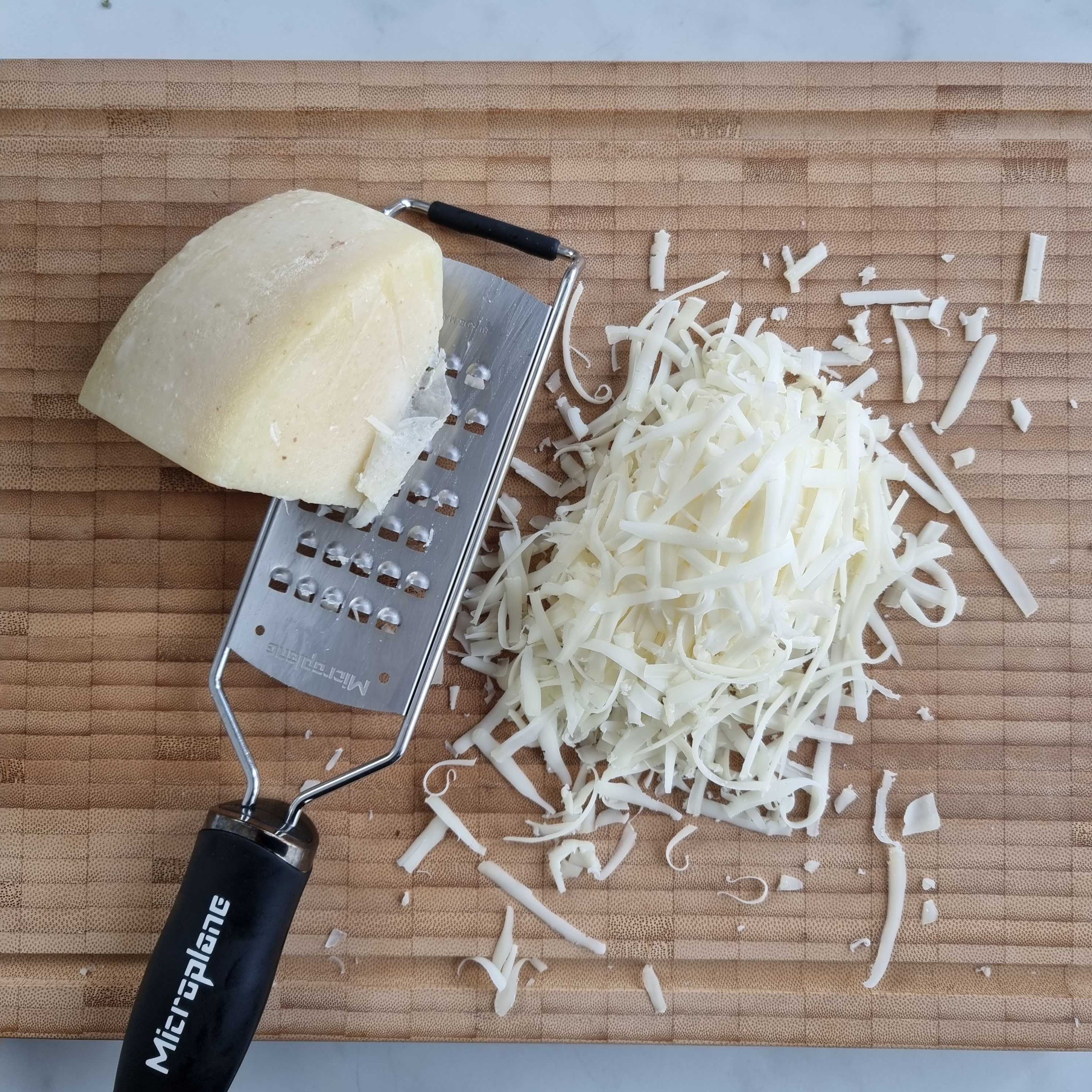 In the meantime, toast the almonds in a small pan. Finely grate the Pecorino cheese. Once they are cool enough to handle, roughly chop the almonds.