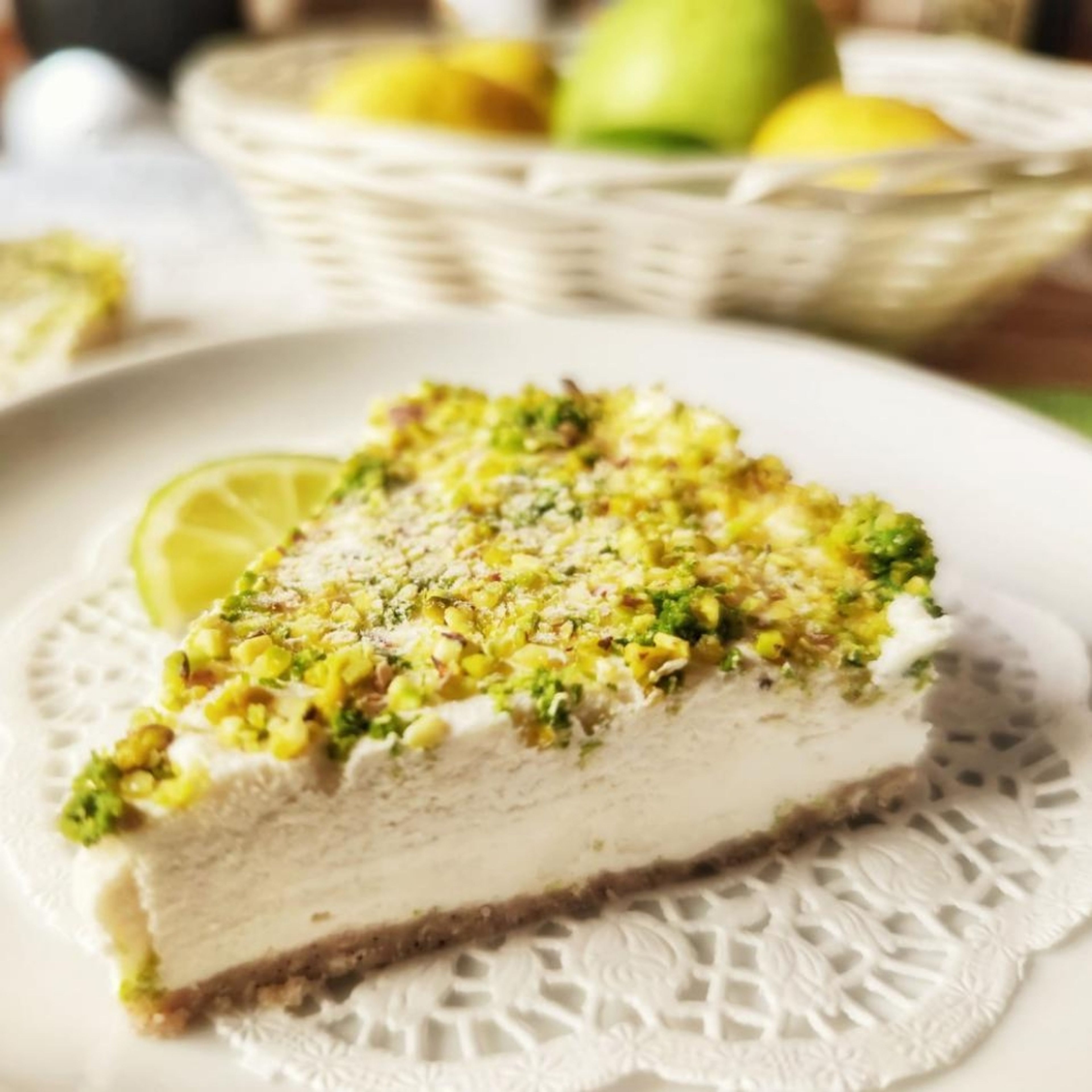Take out the mold with a crust from the freezer, spread the cream over it, and sprinkle on the top of it with the ground pistachio and lime zest. Put it back in the freezer for another 45 min, and serve it cold. Delicious for hot summer days!