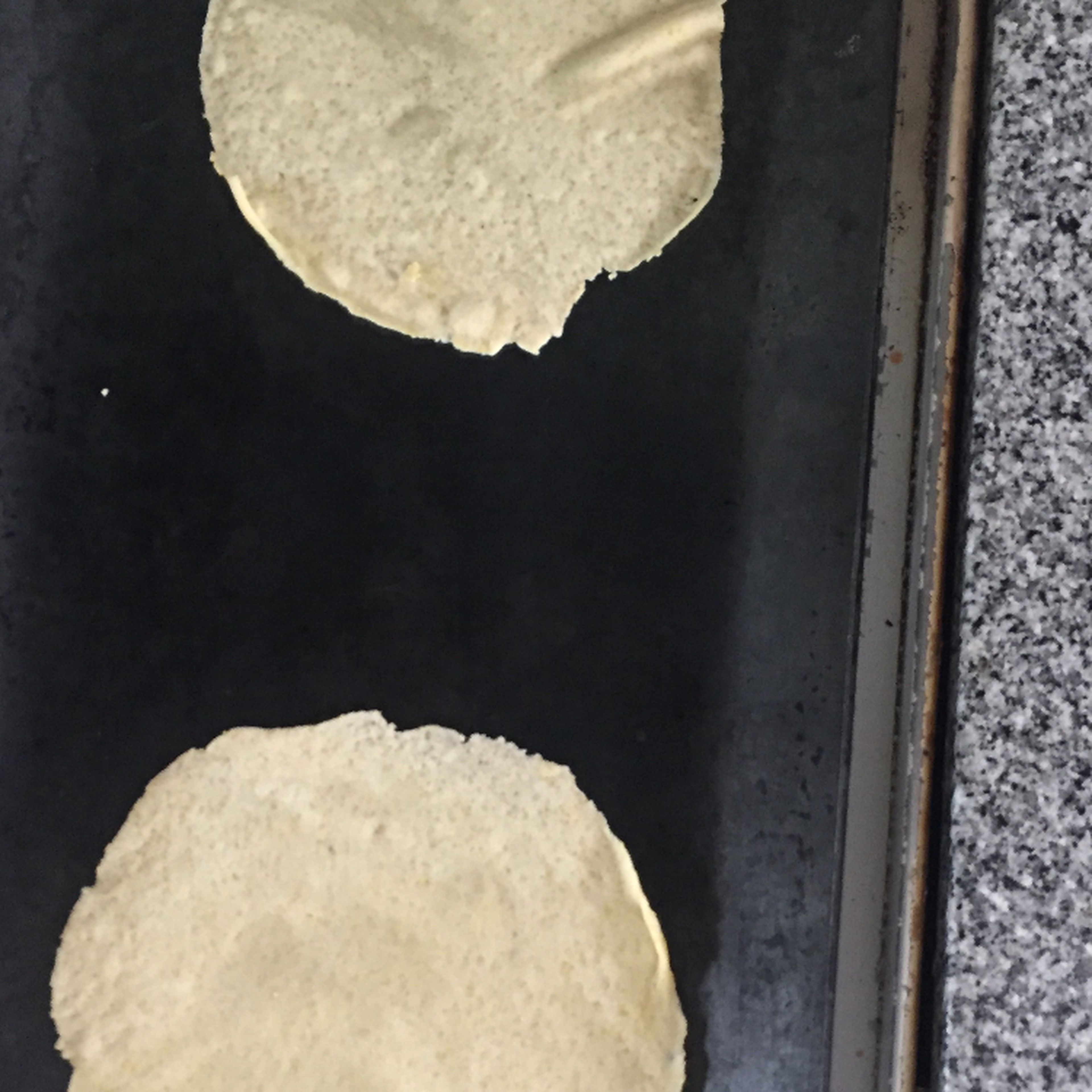 heat up a skillet or pan. Once hot, throw your tortillas over it. Once small bubbles start to form, flip. Do not allow to toast, because this will cause them to break apart once you fold them. (a tip is to make sure that both sides are white with just a few brown spots.)