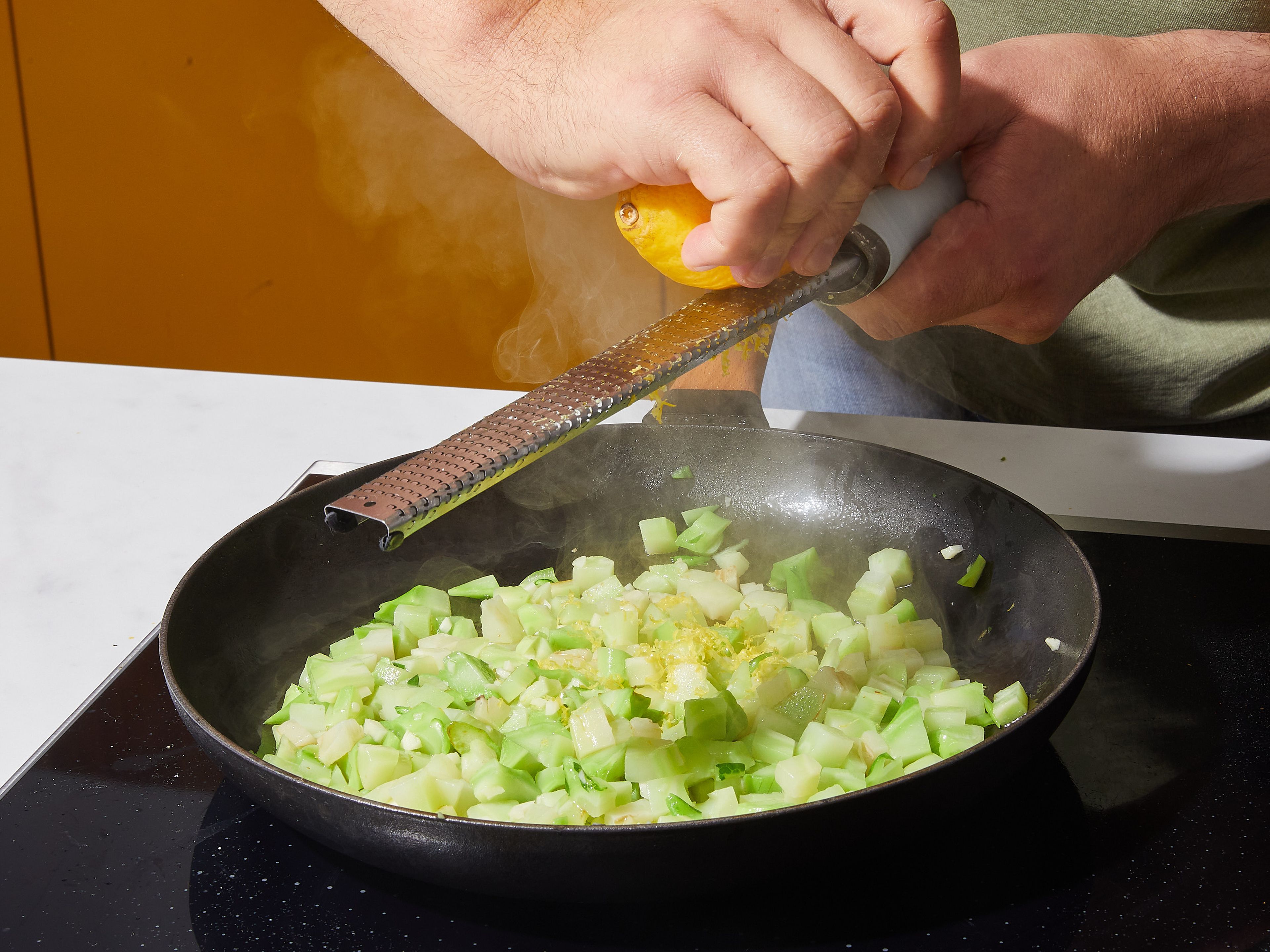 Wipe out frying pan and place over medium heat. Add olive oil, then add garlic and broccoli and let cook approx. 2 min. Remove from heat and toss with lemon zest, juice, salt, and pepper.