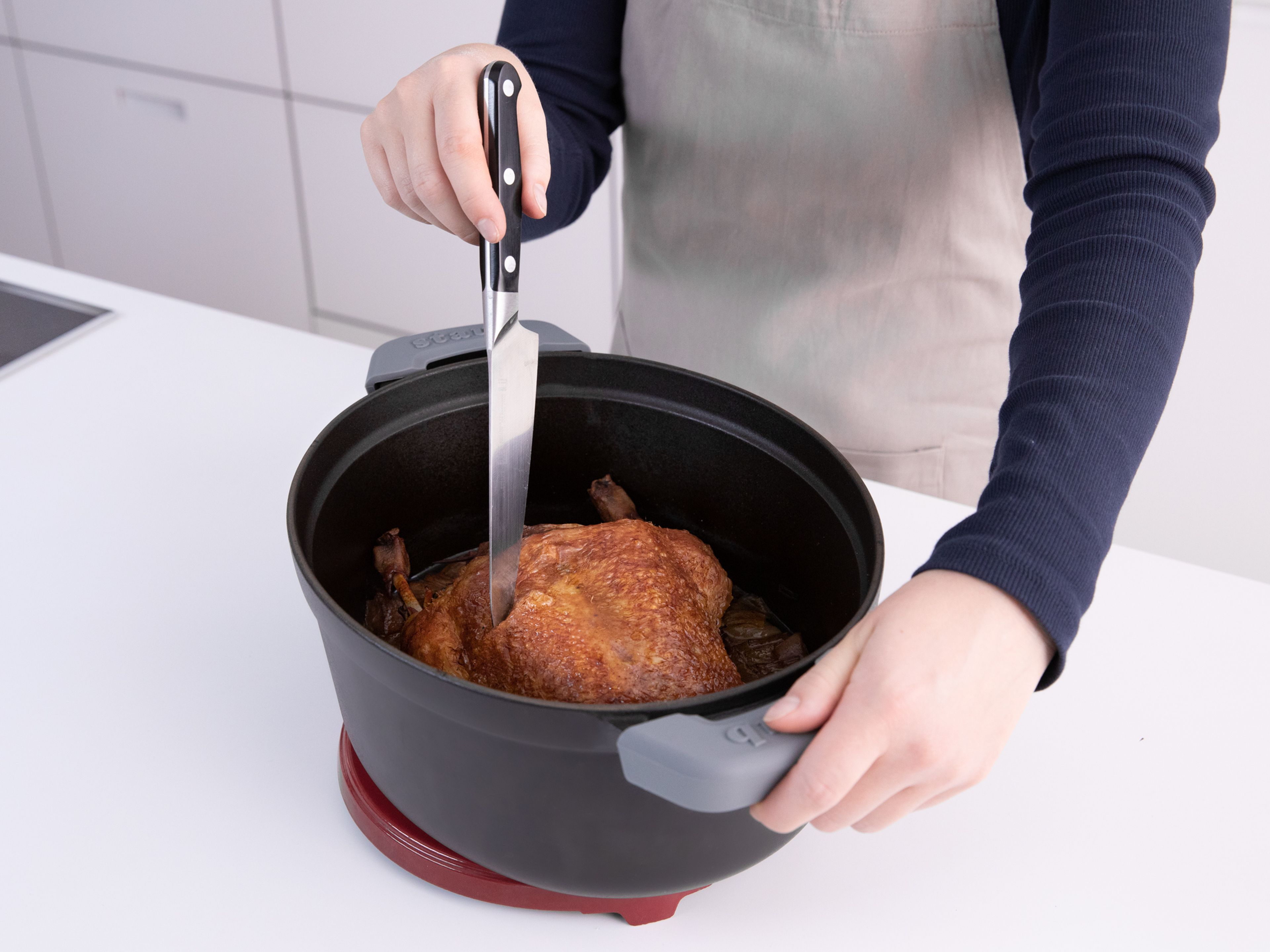 There are two ways to test whether a roast chicken, duck, or turkey is done without a food thermometer. For the first method, pull on the drumsticks. If they come loose or off rather easily, the bird is cooked. For the second method, prick a thick part of the bird with a sharp knife. When the juice that runs out is clear, it’s done.