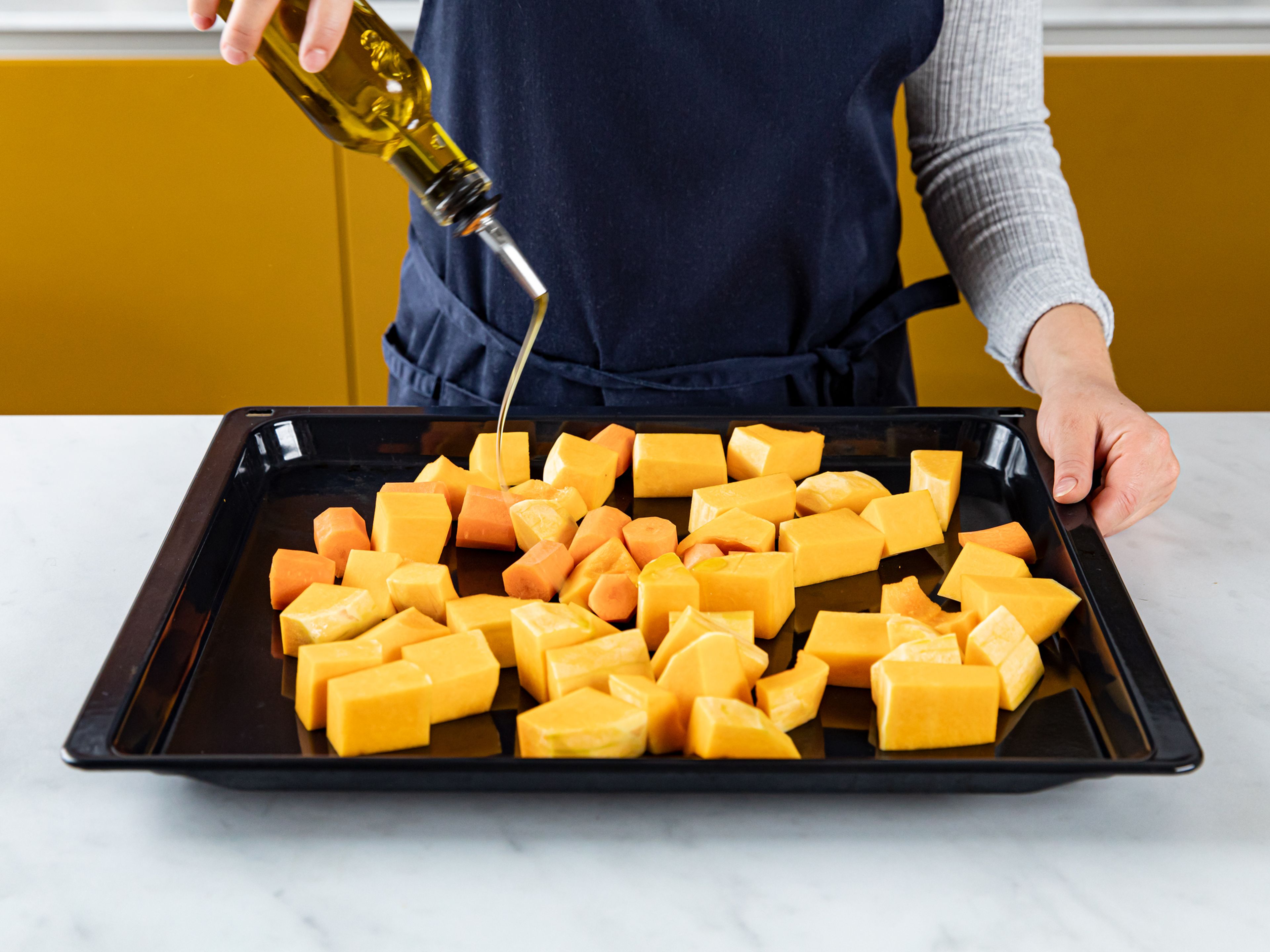 Toss butternut squash and carrot in olive oil, salt, and pepper. Place on a baking sheet and bake for approx. 40 min., turning the pieces occasionally so they brown evenly.
