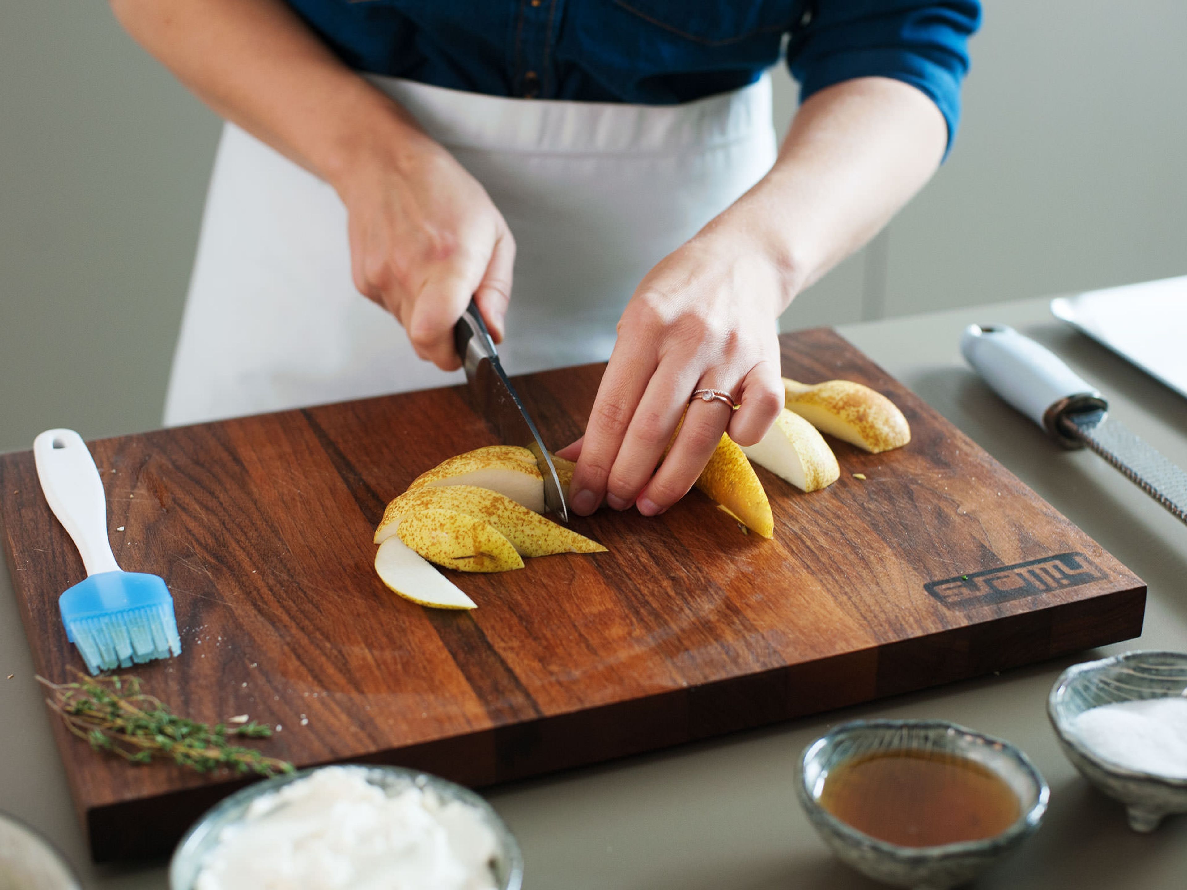 Increase oven temperature to 220°C/425°F. Slice pears and arrange on parchment-lined baking sheet.