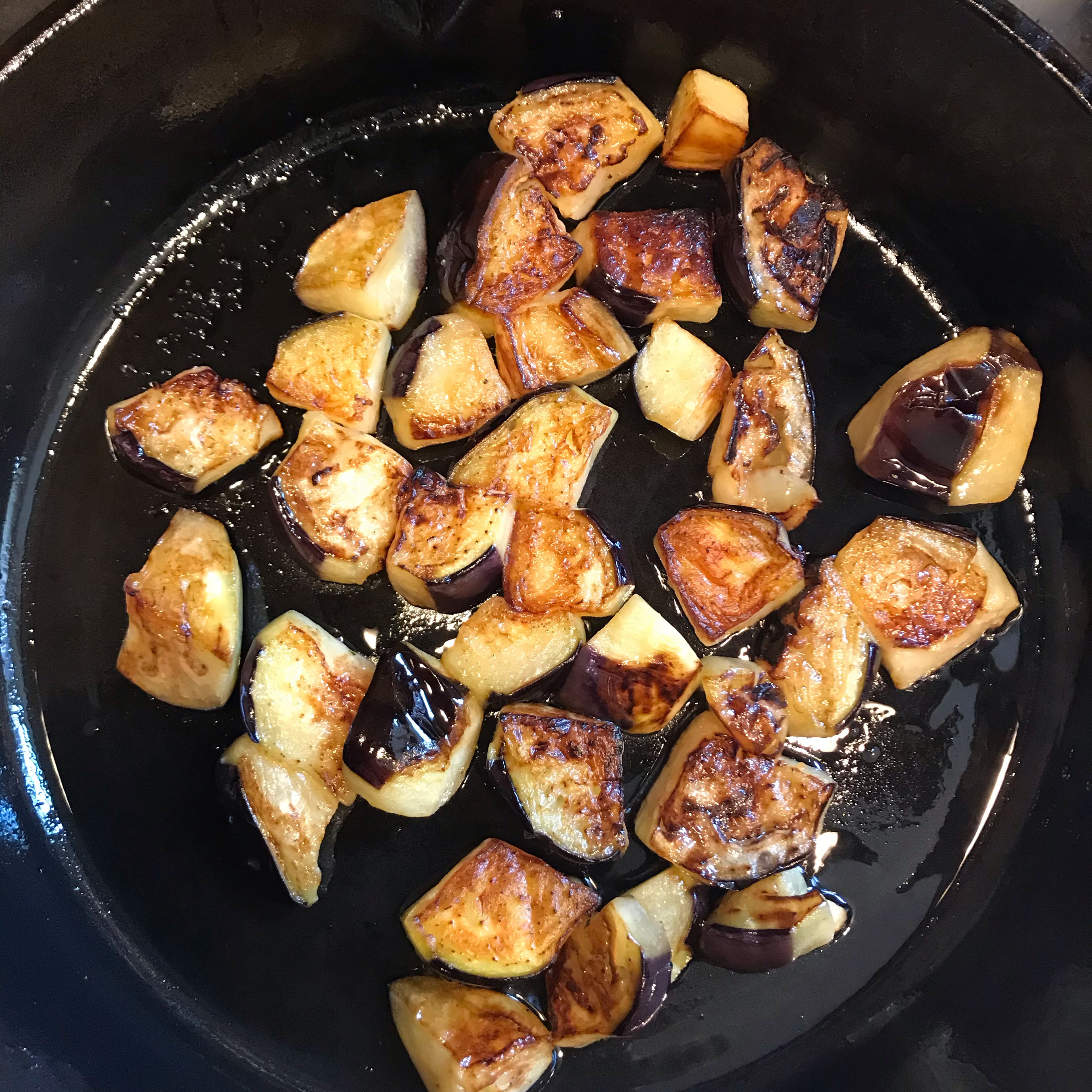Chop the aubergine and fry them in the olive oil until golden colour