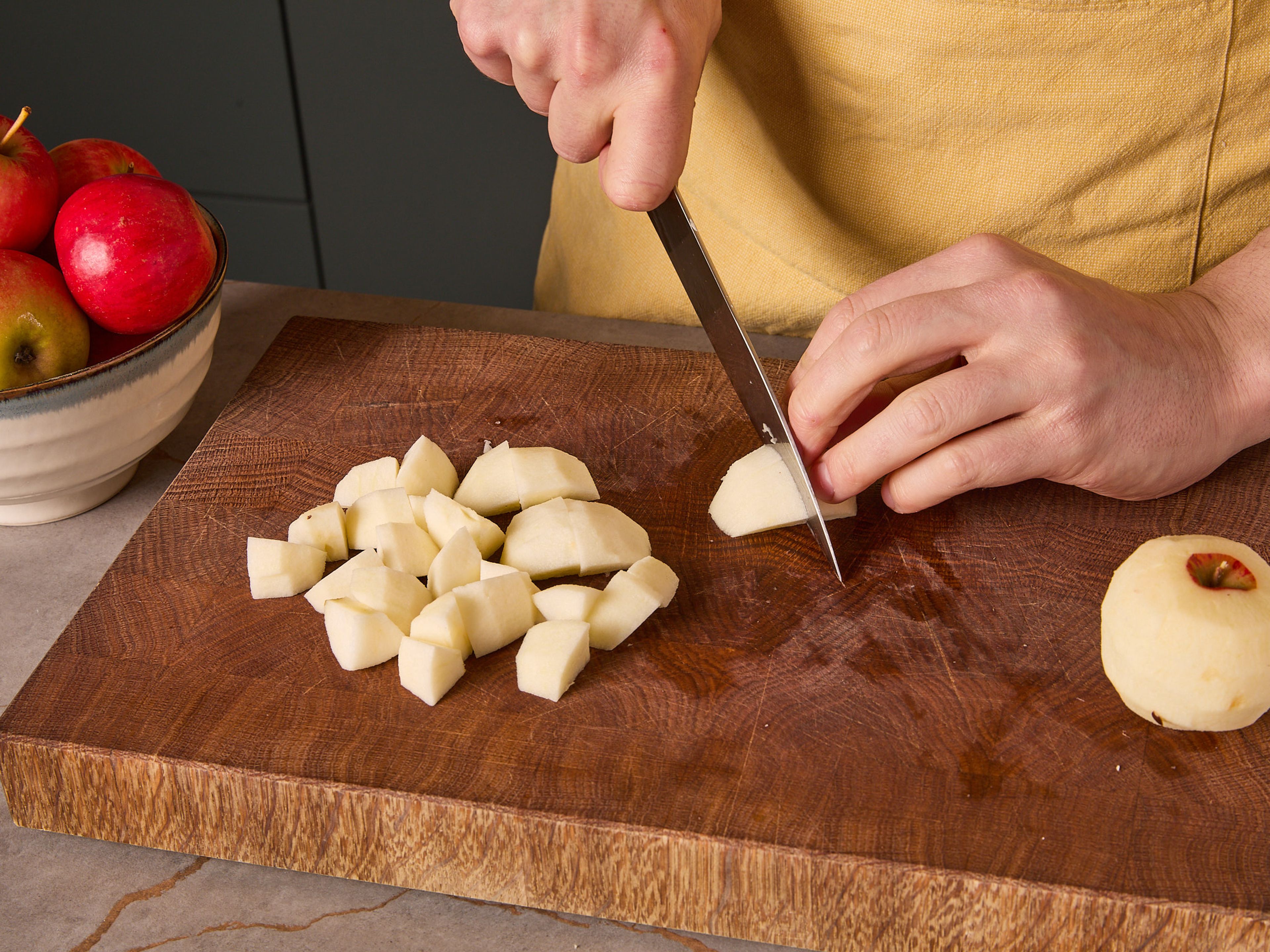 Peel apples, quarter them, and remove the cores. Cut apple quarters into large chunks and fold into the batter. Pour the batter into the buttered springform pan and smooth the surface slightly. Bake in the preheated oven for approx. 50–60 min. until golden brown. If the cake starts browning too early, simply cover with aluminum foil for the remaining baking time. Once baked, brush the still-hot cake with the remaining butter and let it cool completely. Dust with confectioner’s sugar and serve.