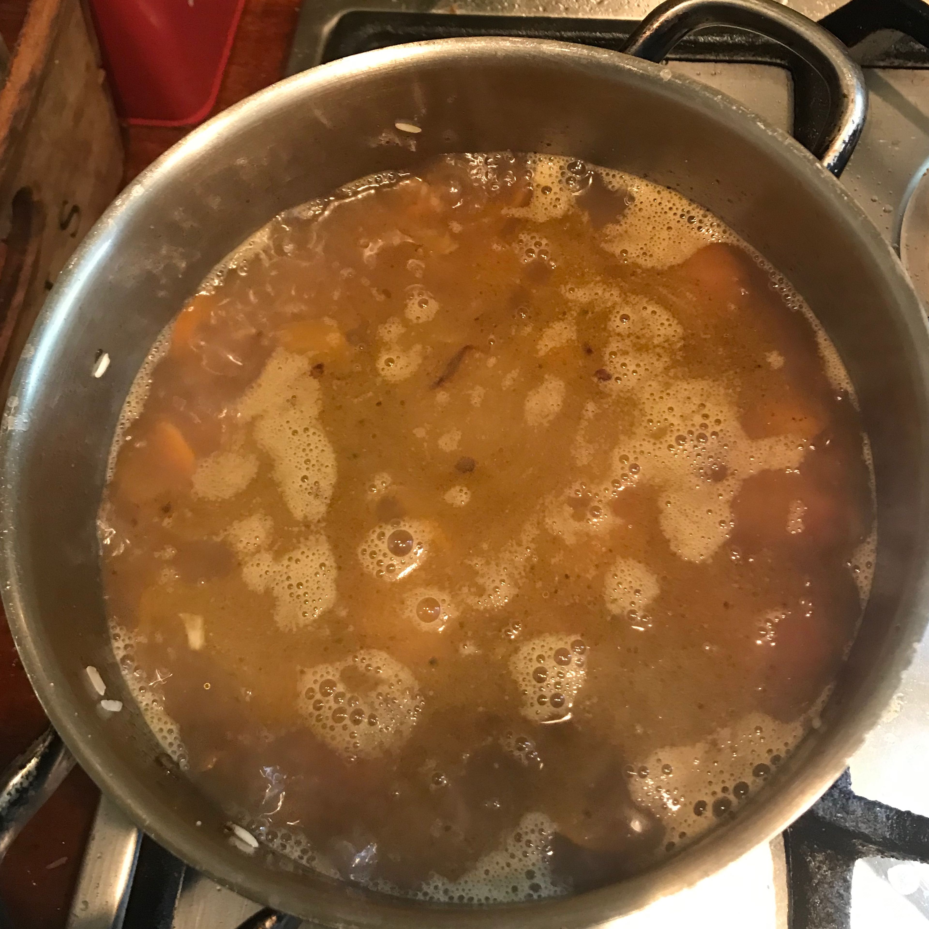 Add the stock, salt and the boiling water. Do not stir! Put a lid on and simmer in low heat for 15 minutes or until all the water is absorbed.