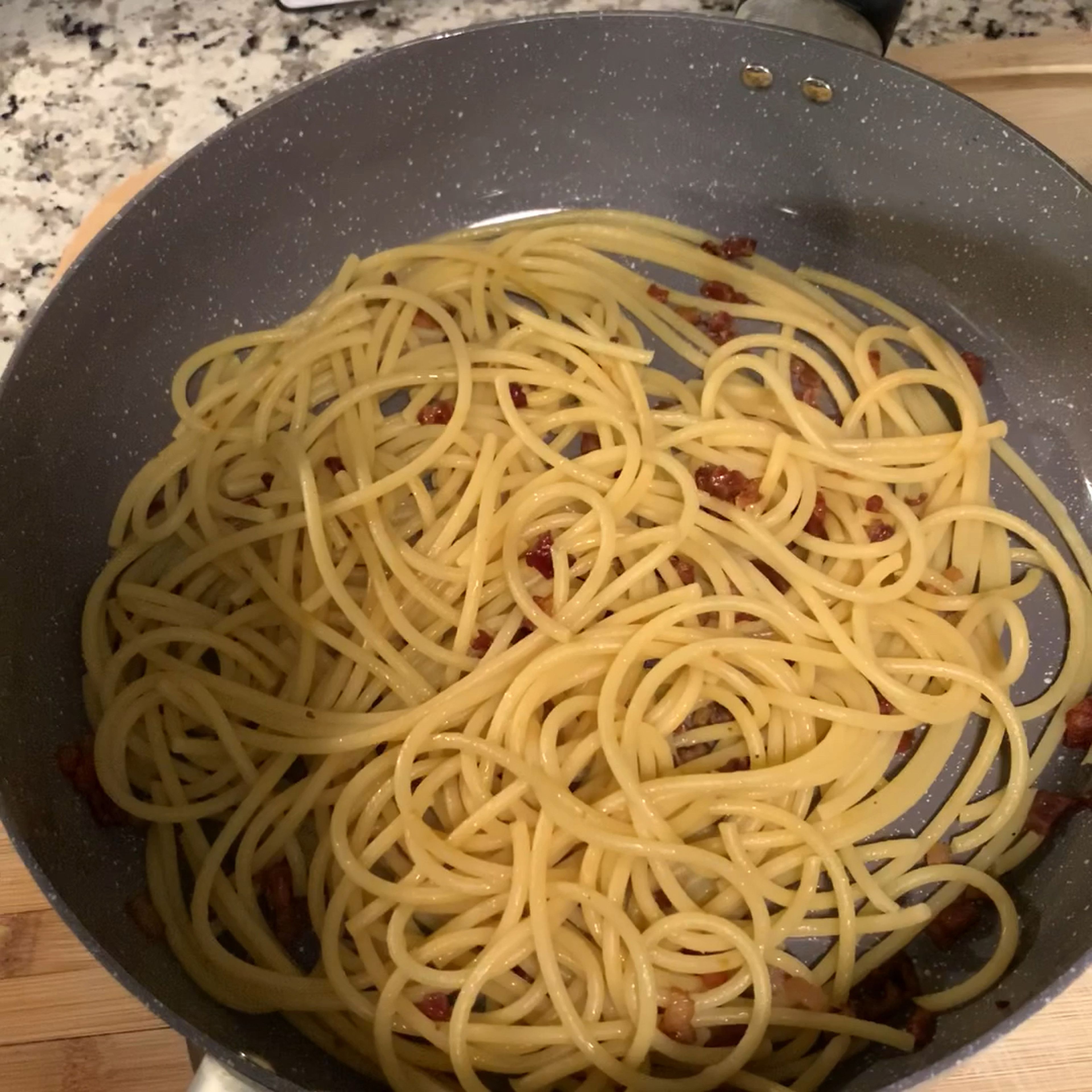 Add egg and Parmesan mix to noodles and mix right away.