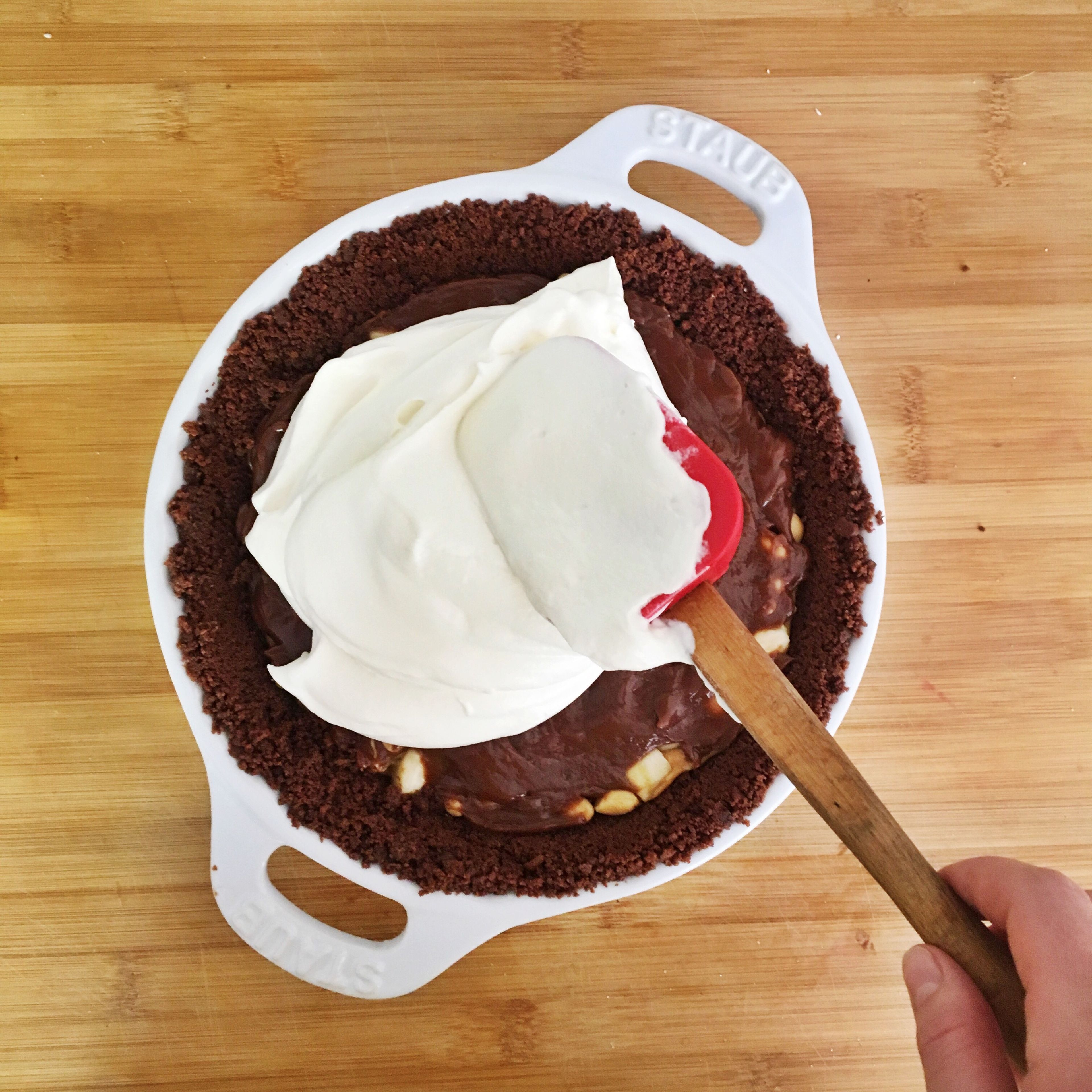 Beat cream with sugar until stiff. Spread on top of the pie.
