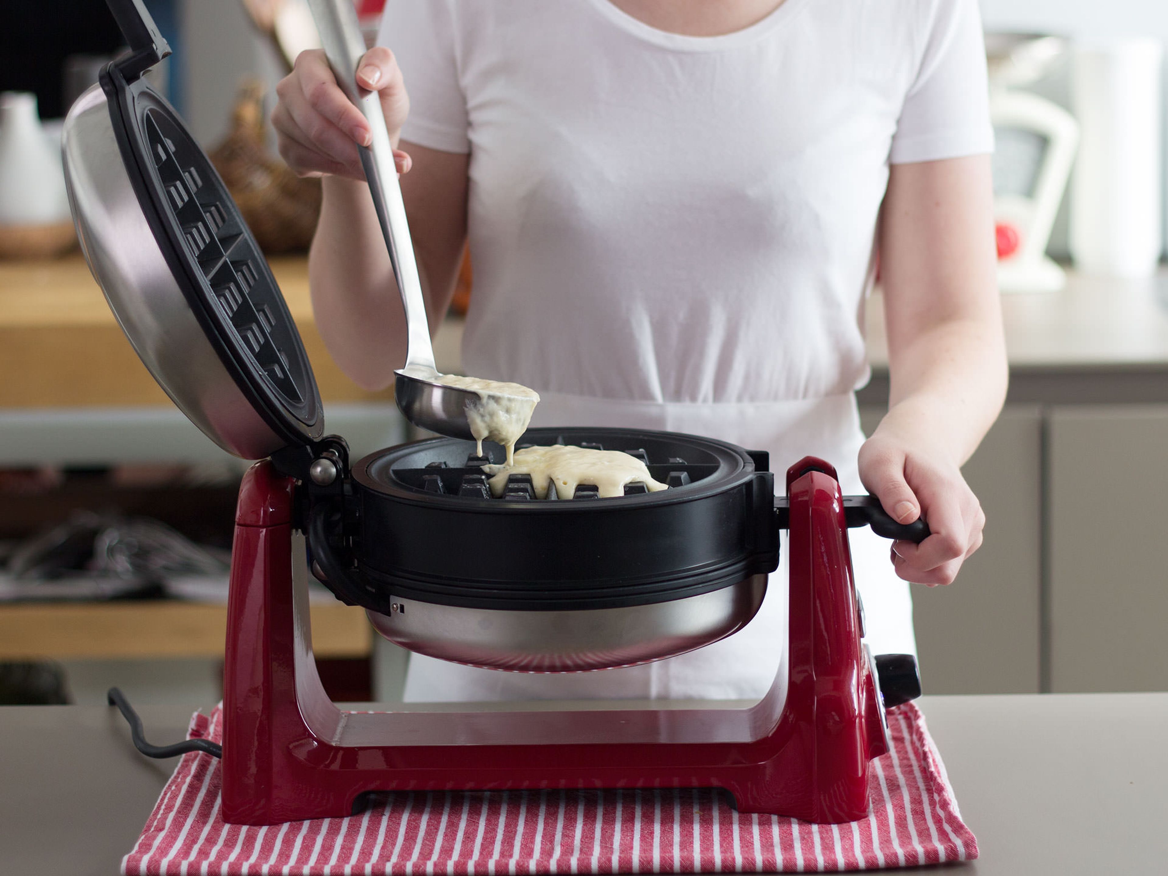 Preheat a waffle maker and grease with some butter. Pour some of the batter into waffle maker and cook for approx. 3 – 4 min. or until golden brown. Serve straightaway with blueberry sauce. Garnish with confectioner’s sugar, if desired.