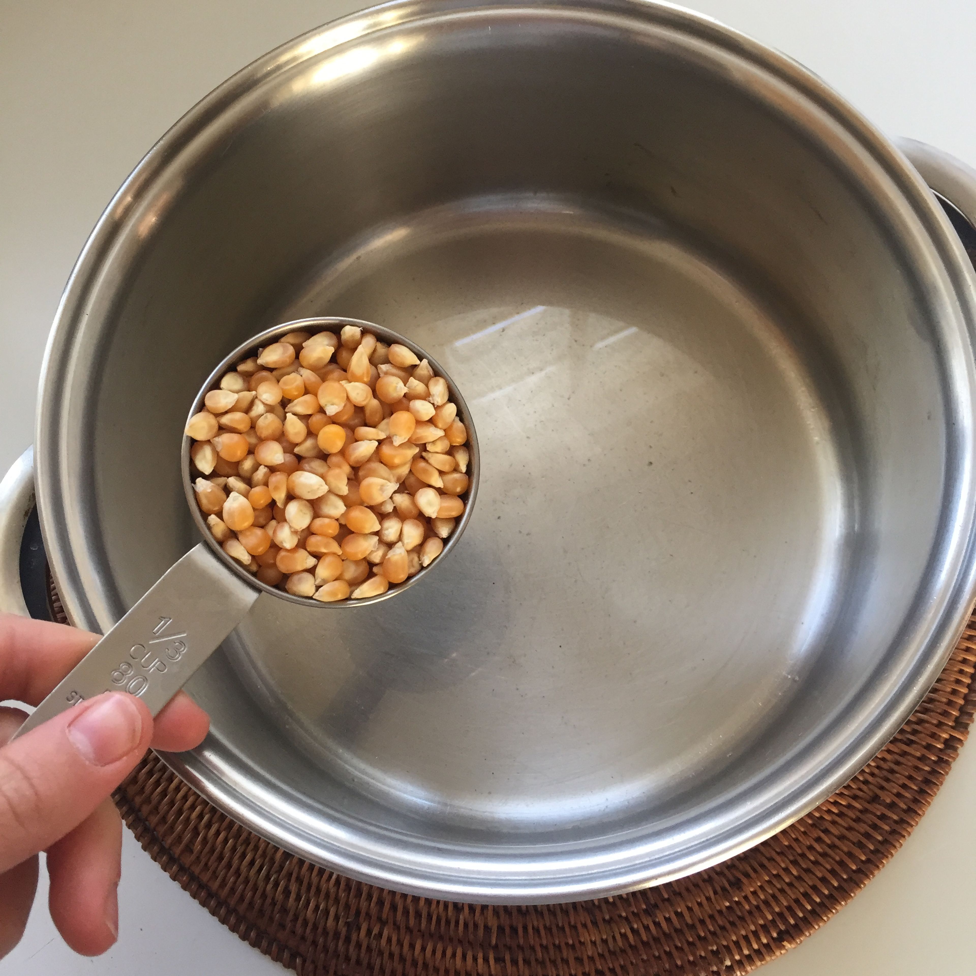 Pour the popcorn kernels (about 1/3 cup)