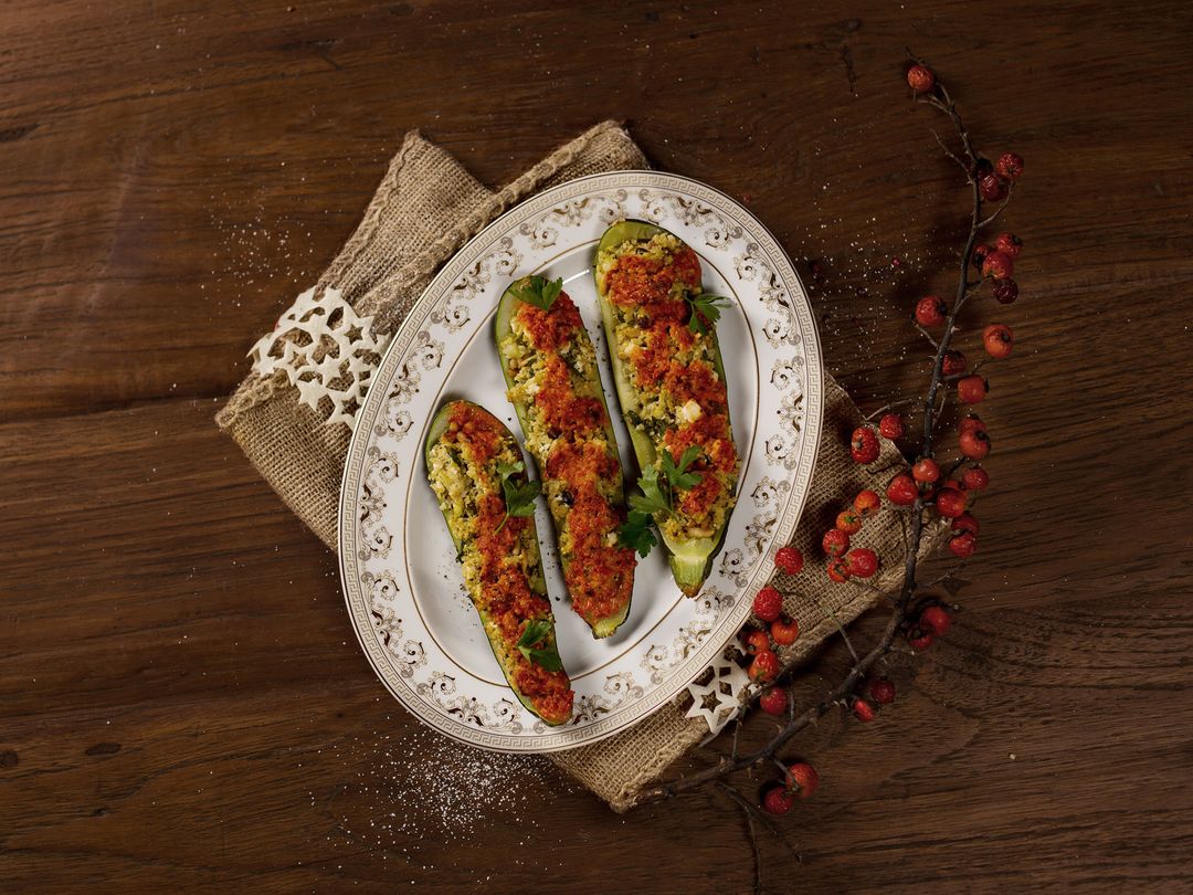 Baked zucchini with millet filling