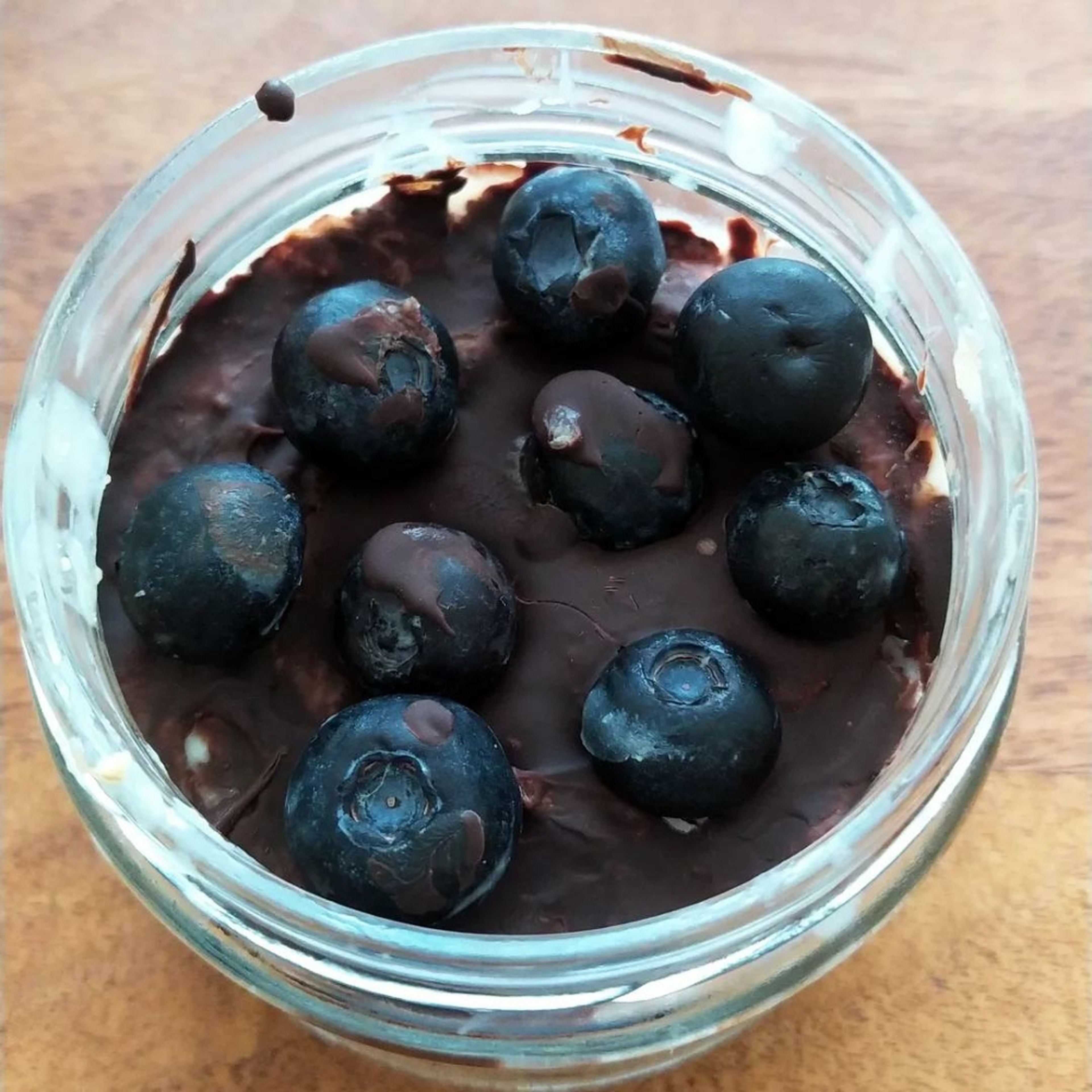 After waiting for 3 hours in the fridge, add the rest of the melted chocolate and blueberries on your oats and leave it overnight.that's it