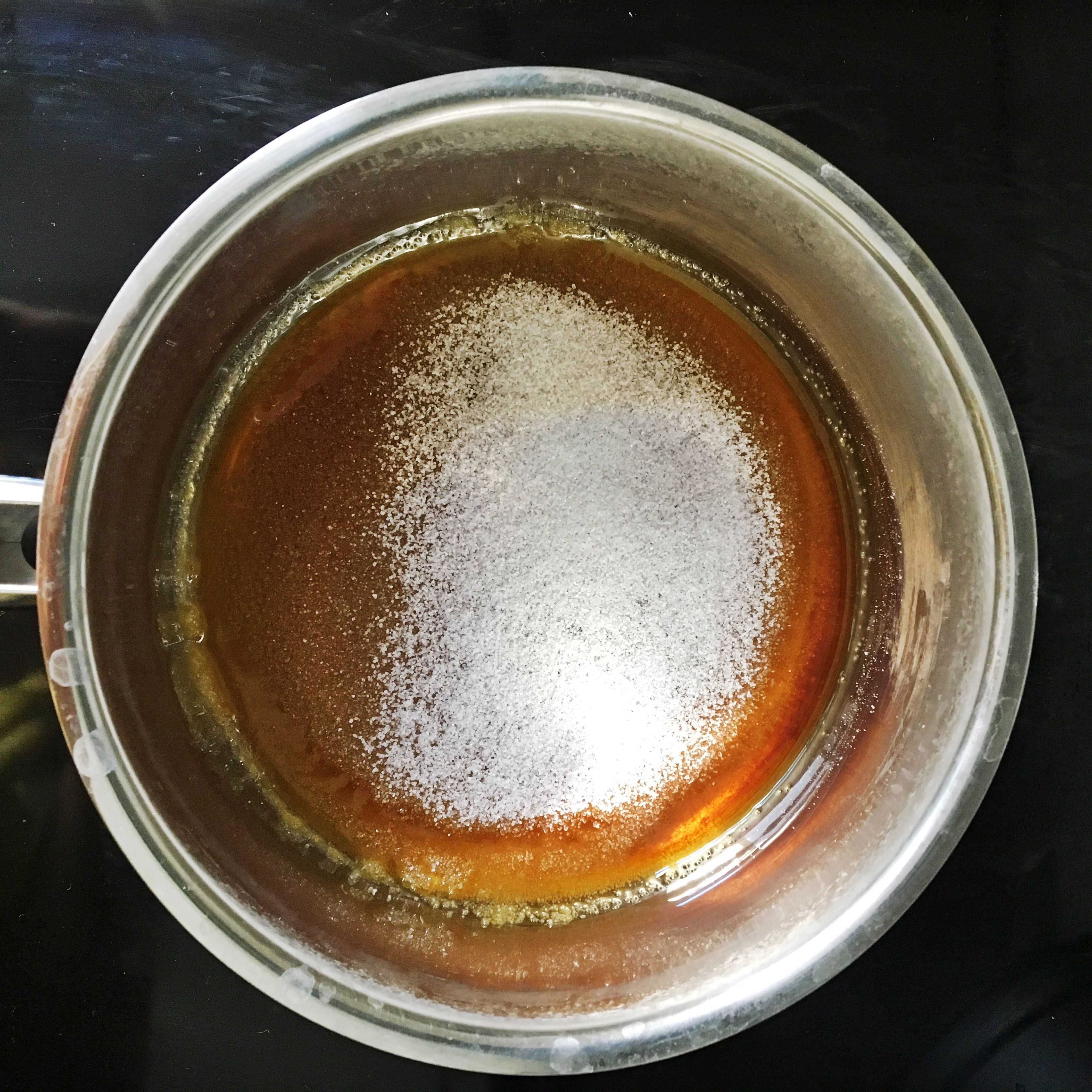 For the caramel sauce, add sugar to a saucepan over medium heat and let it caramelize. Finely chop milk chocolate. Once the sugar is melted, add cream and bring to a simmer. Carefully stir until combined. Add the butter. Remove the saucepan from heat and pour caramel over chopped chocolate. Stir to combine, until the chocolate is melted.