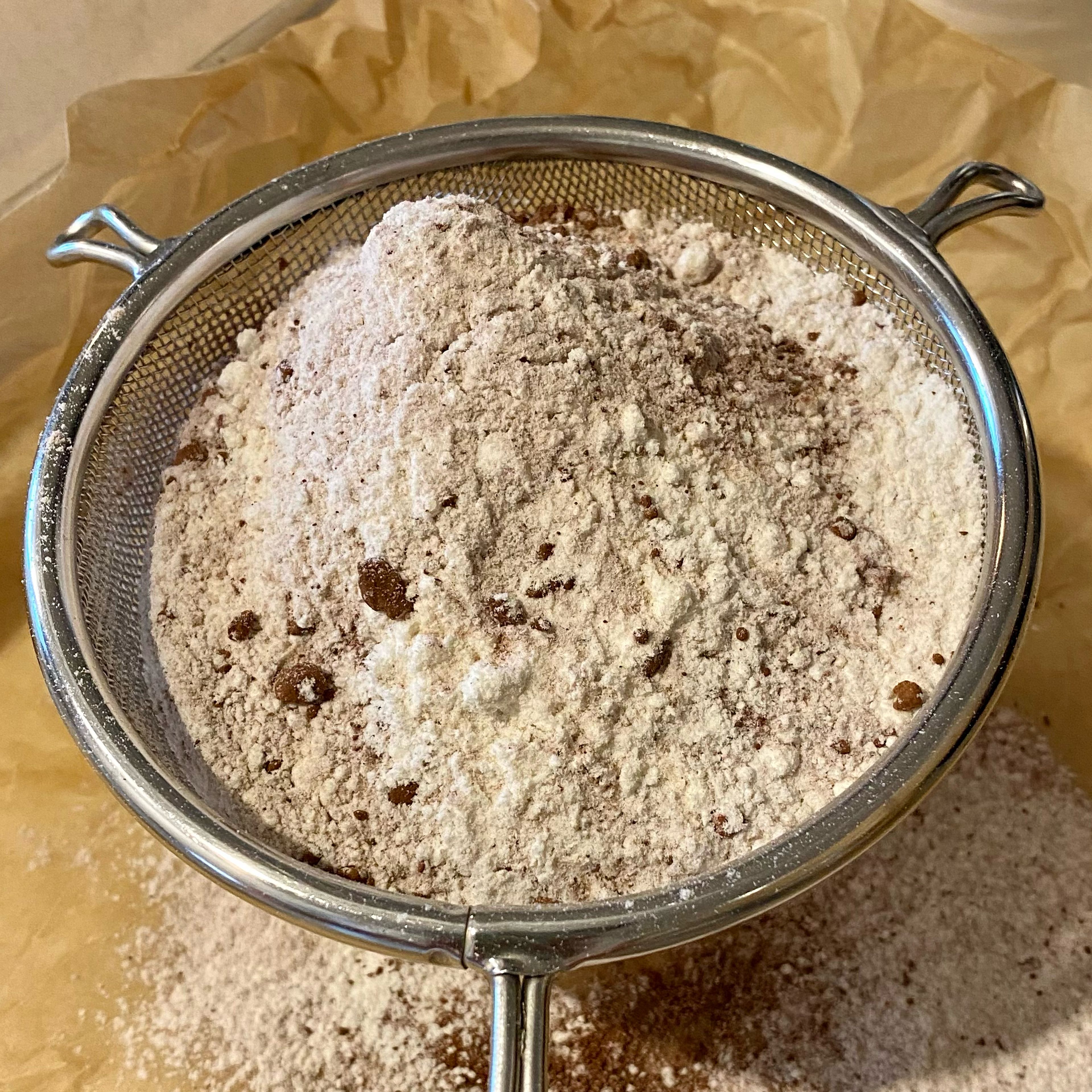 Combine the (150g) Cake flour, (7g) All-purpose flour, (10g) Dutch-processed cocoa powder, (1 teaspoon) baking powder, and (½ teaspoon) salt and sift them through a mesh strainer, at least 2 times. Set aside. 