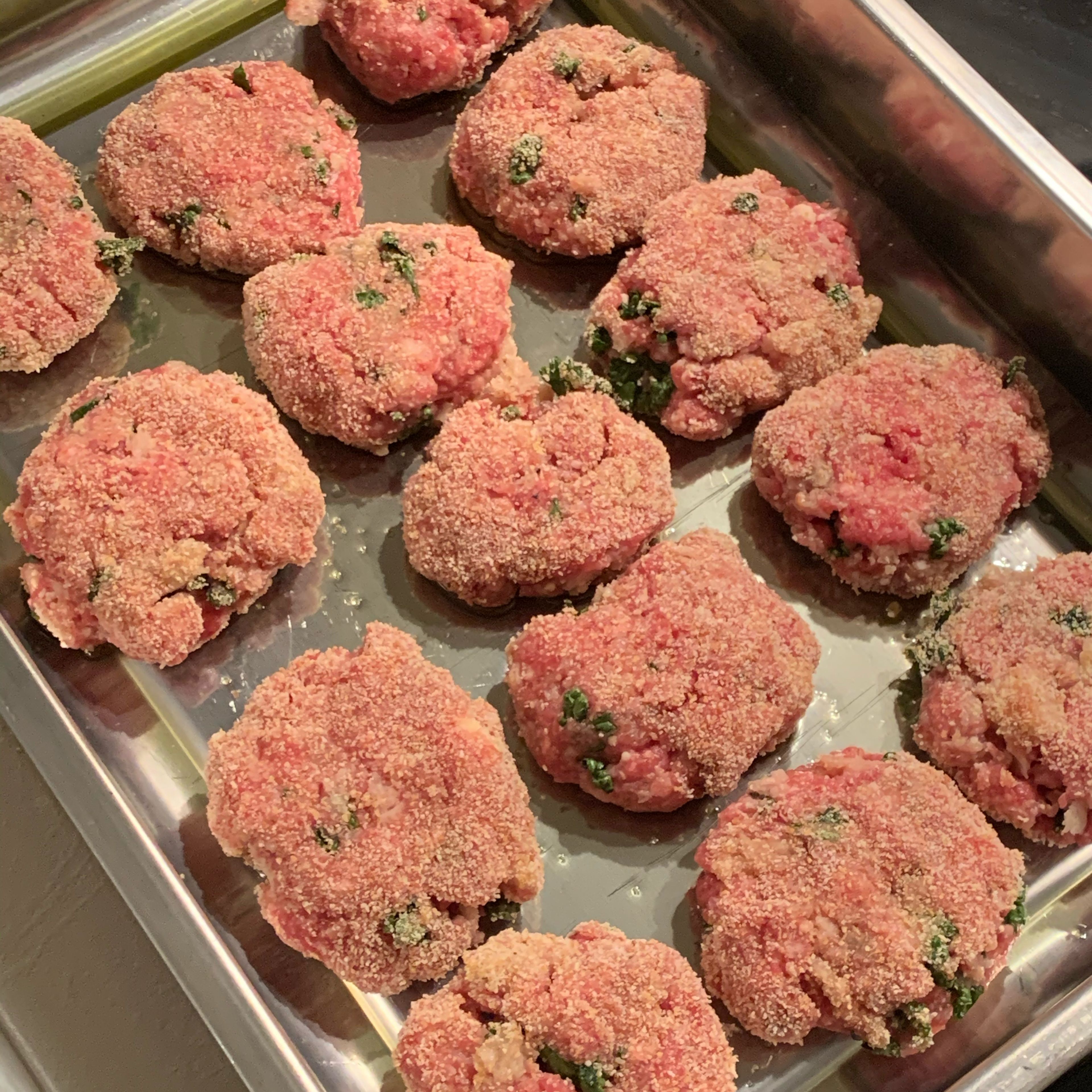 Place the meatballs on an oiled baking tin. Preheat the oven at 180 degrees and let the meatballs cook for about 30/40 minutes (cooking time will depend on the size of the meatballs).