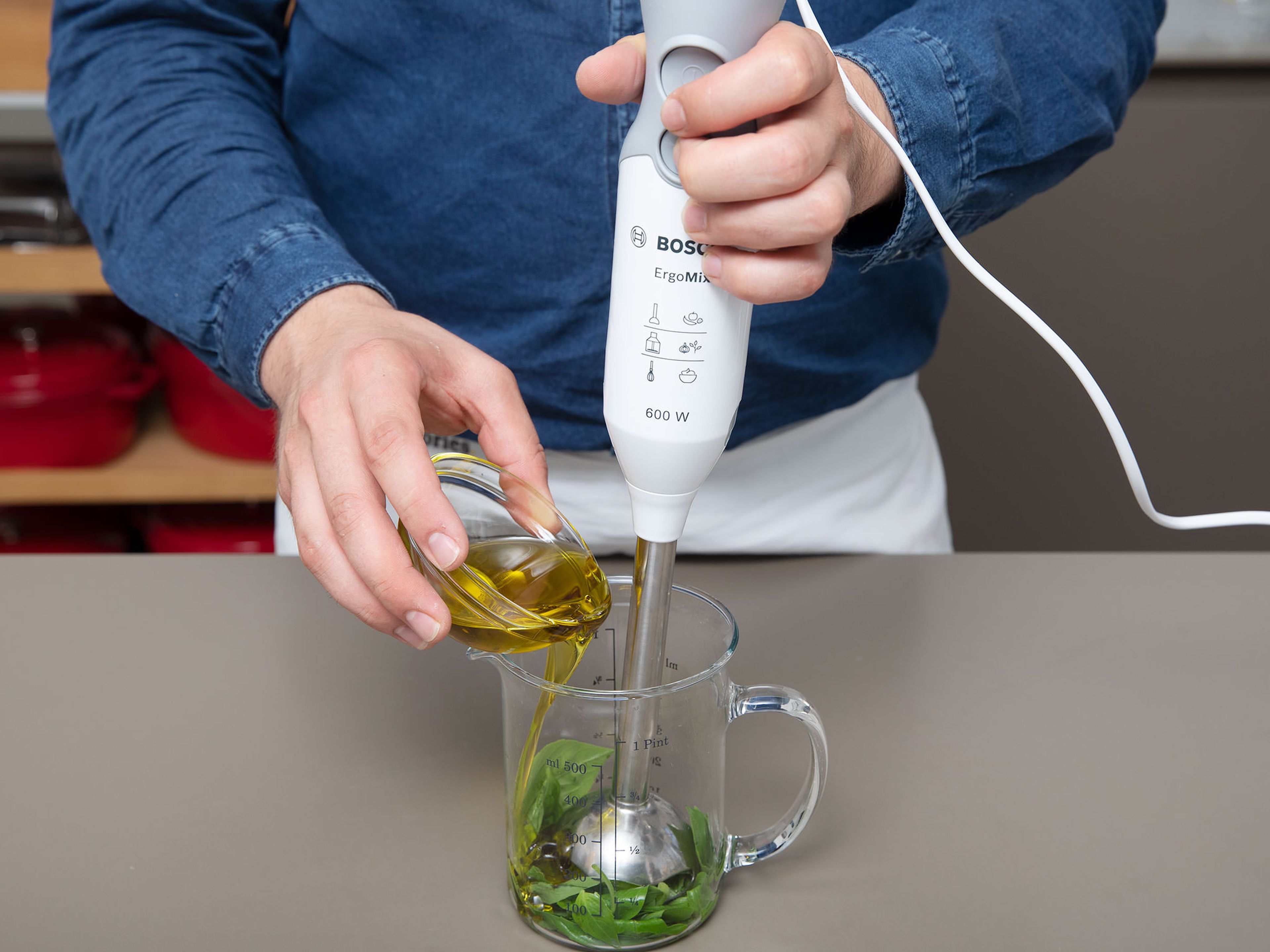 Add blanched basil leaves and olive oil into a liquid measuring cup and pulse until smooth with an immersion blender. Season with salt and pepper and strain the oil through a clean sieve so you are left with the bright green basil oil.